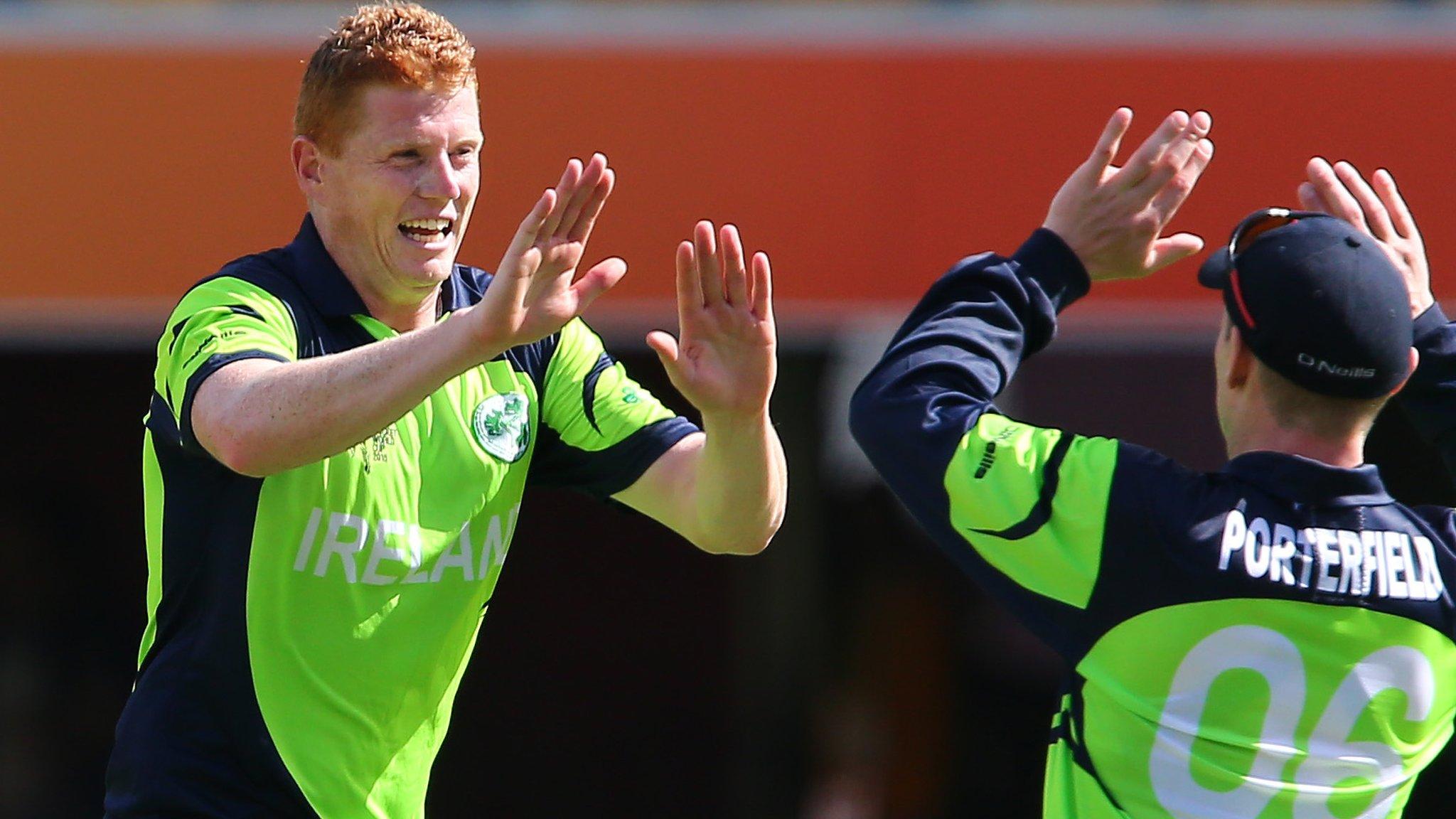 Kevin O'Brien celebrates taking a wicket with Ireland captain William Porterfield