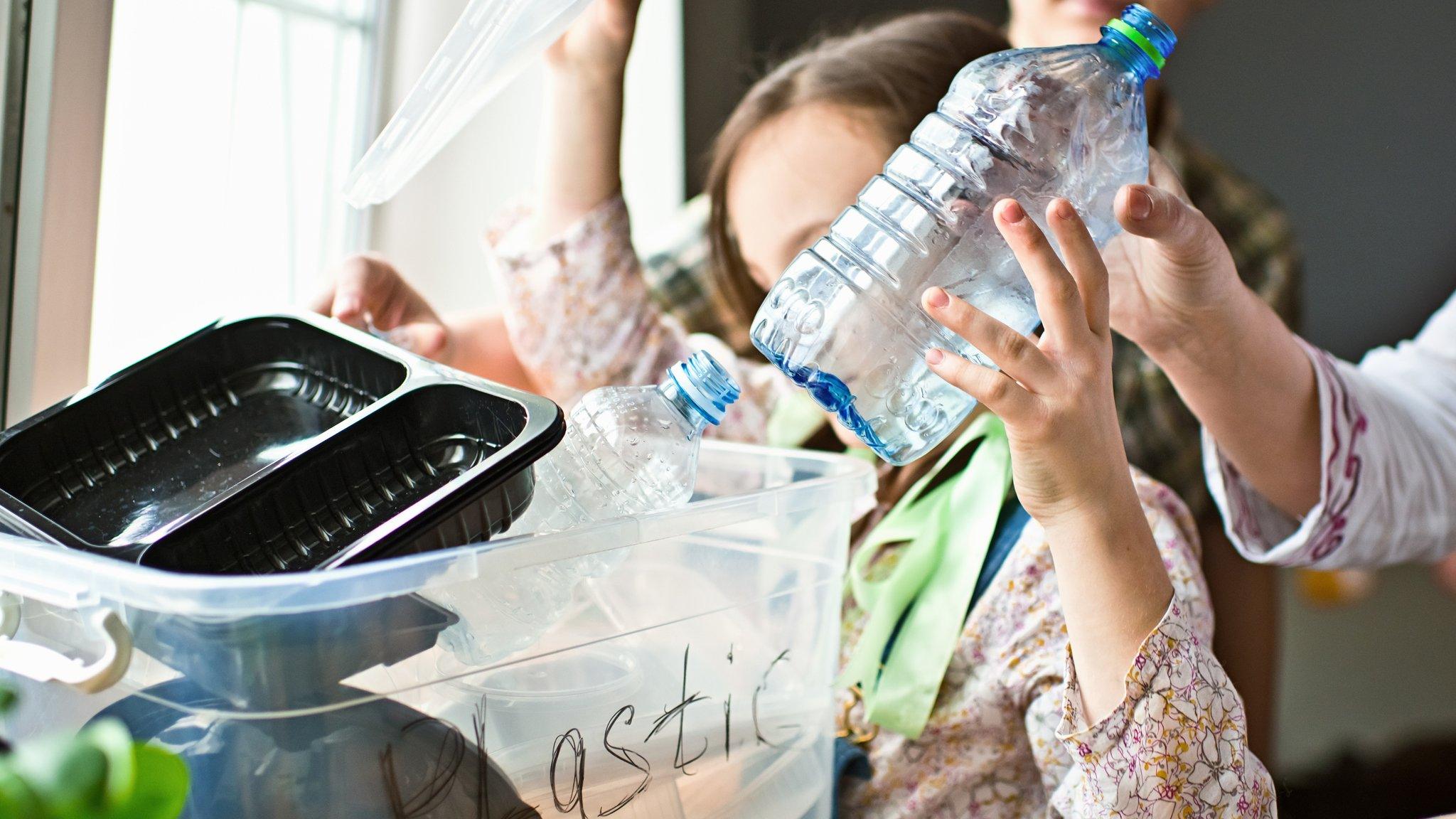 Child sorting recycling