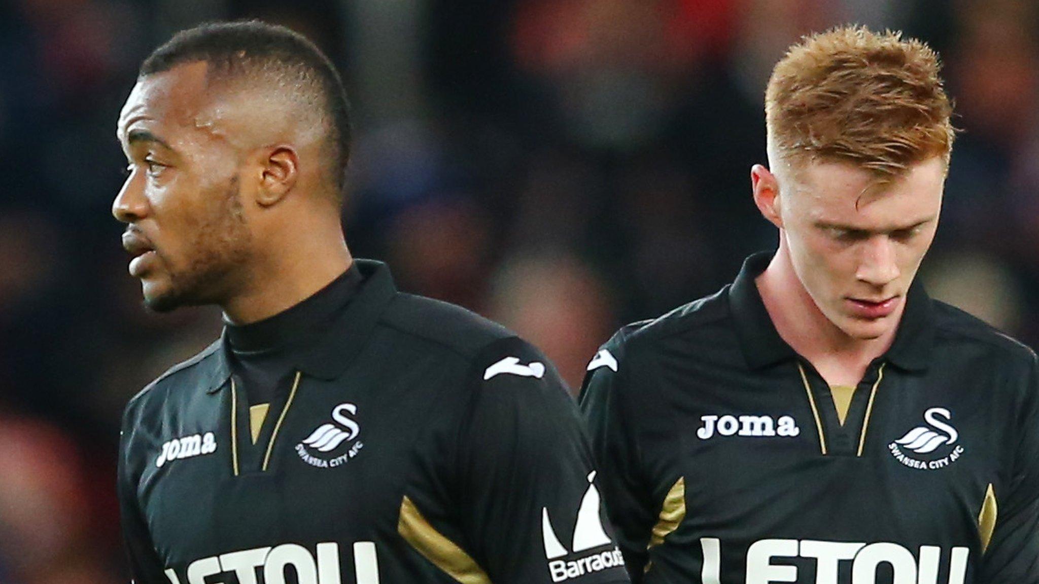 Jordan Ayew (l) and Sam Clucas dejected