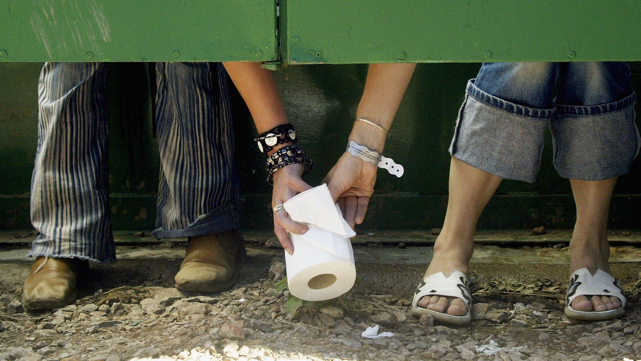 Someone passing toilet roll at Glastonbury