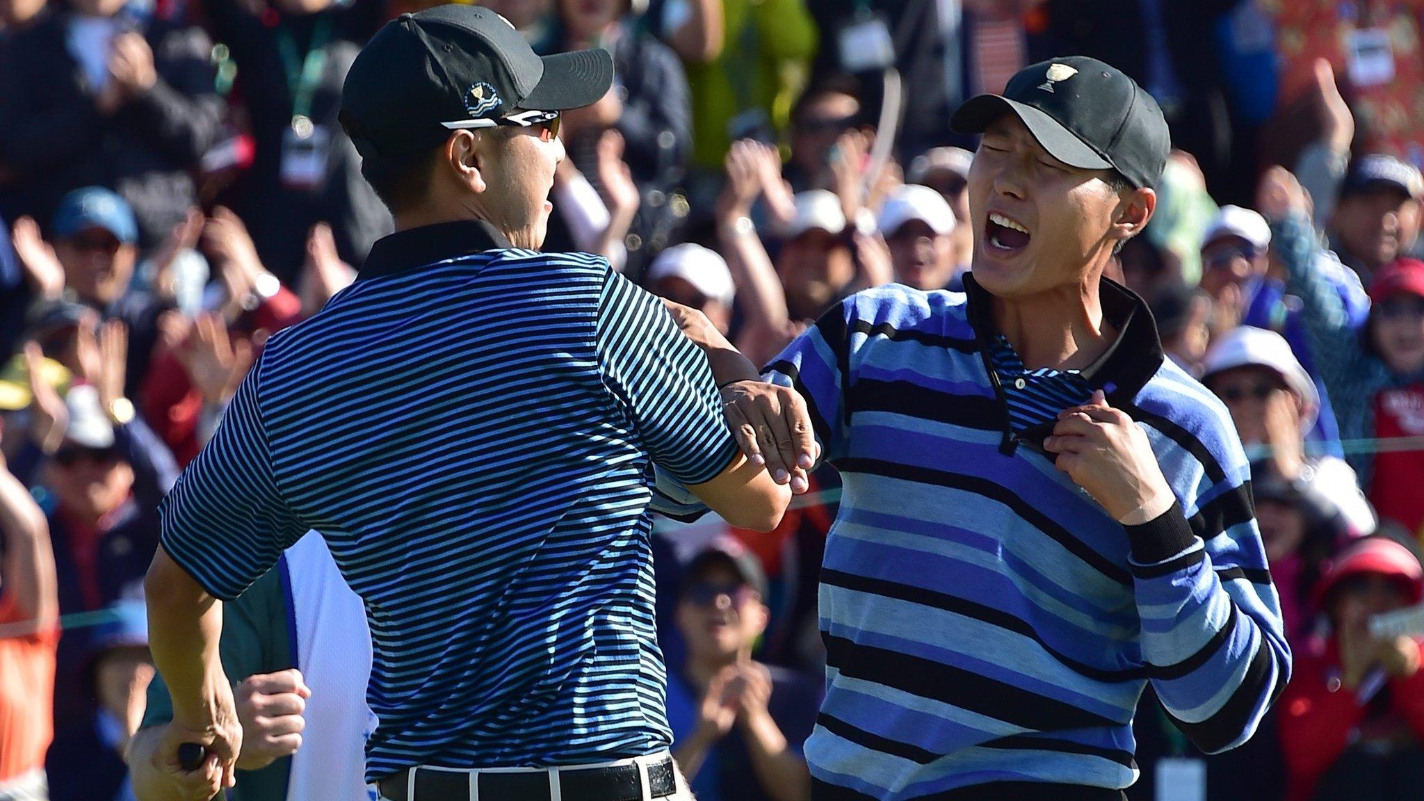 Bae Sang-Moon and Danny Lee celebrate