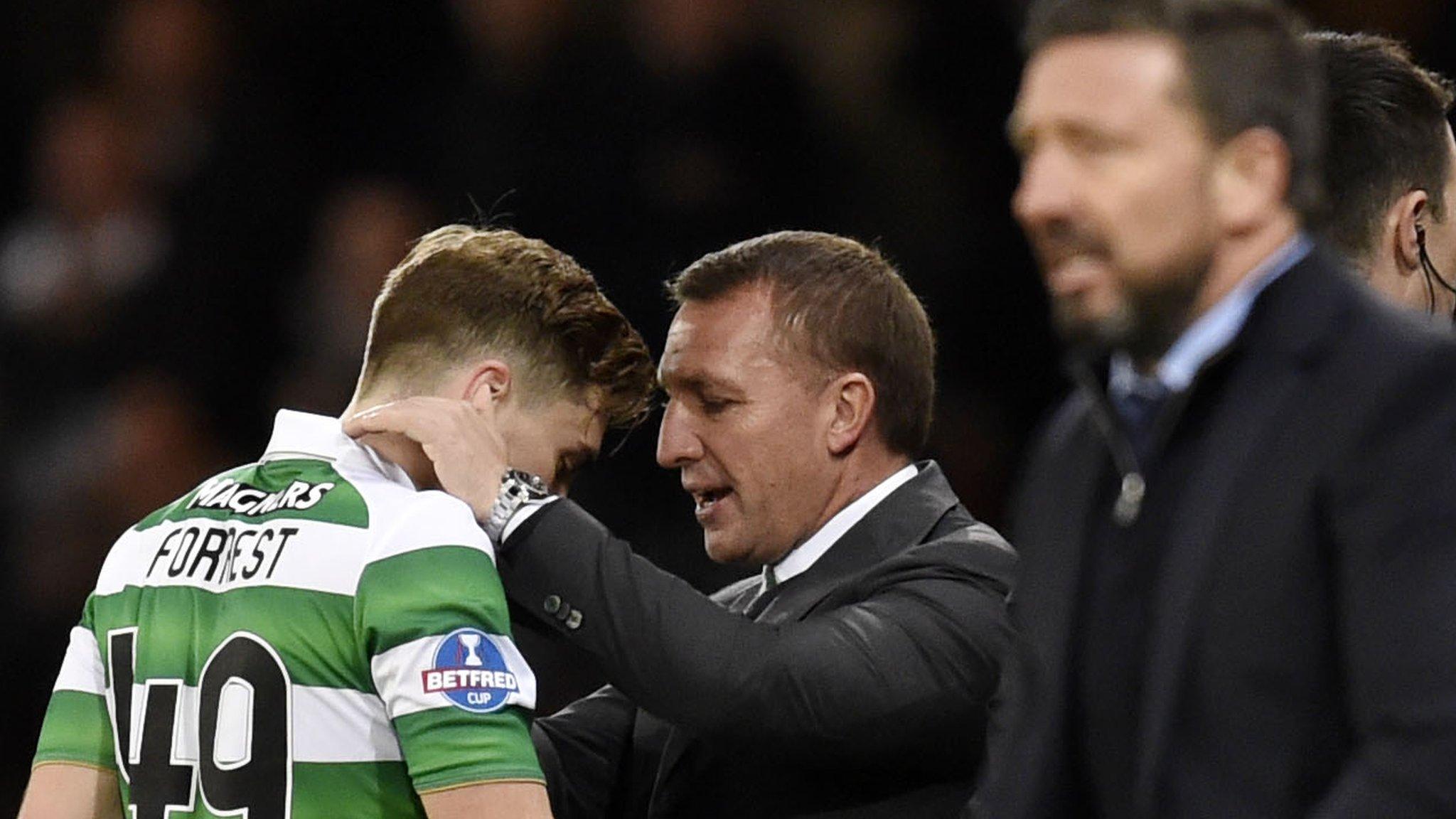 Celtic manager Brendan Rodgers (centre) leaves Aberdeen's Derek McInnes a worried man