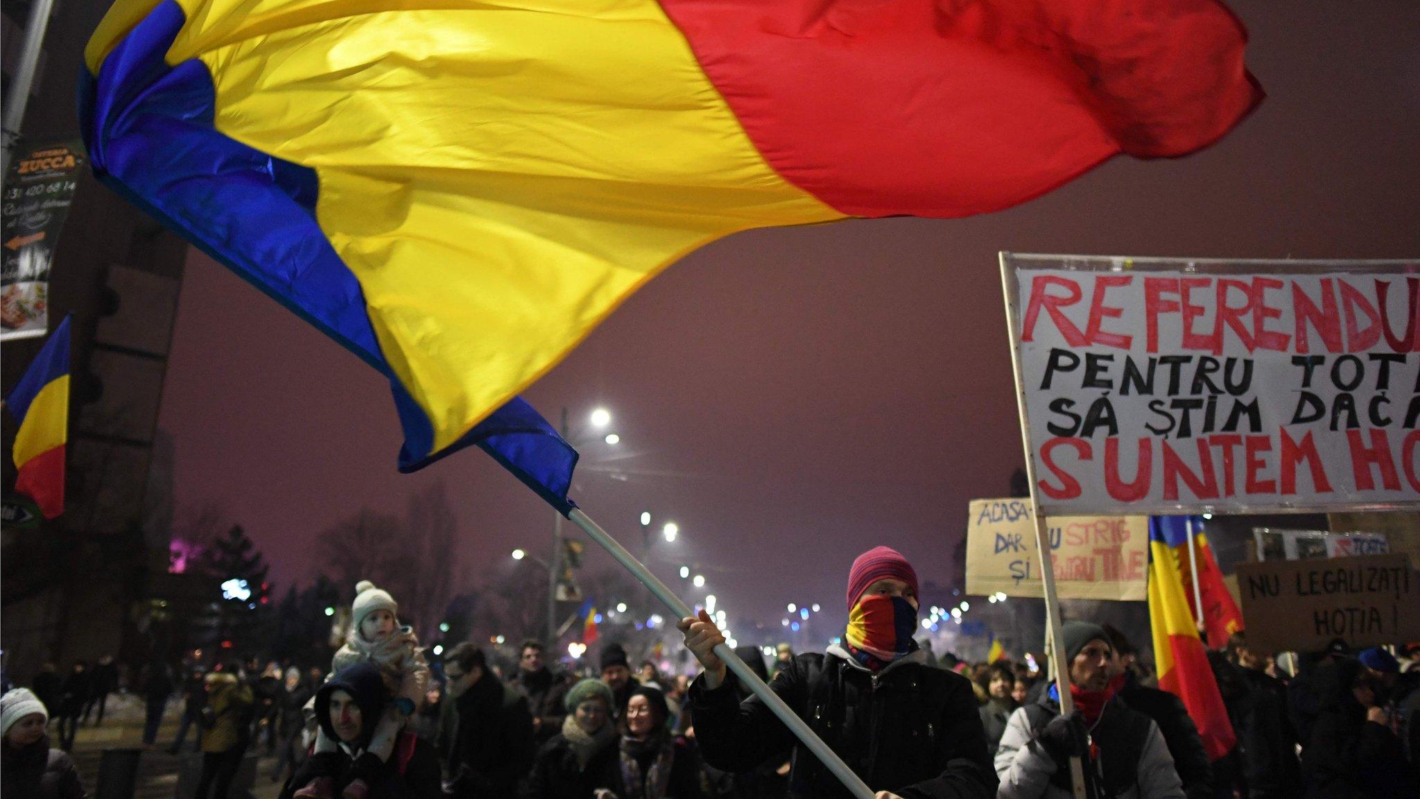 Protesters march during a protest against government in Bucharest, on January 22, 2017