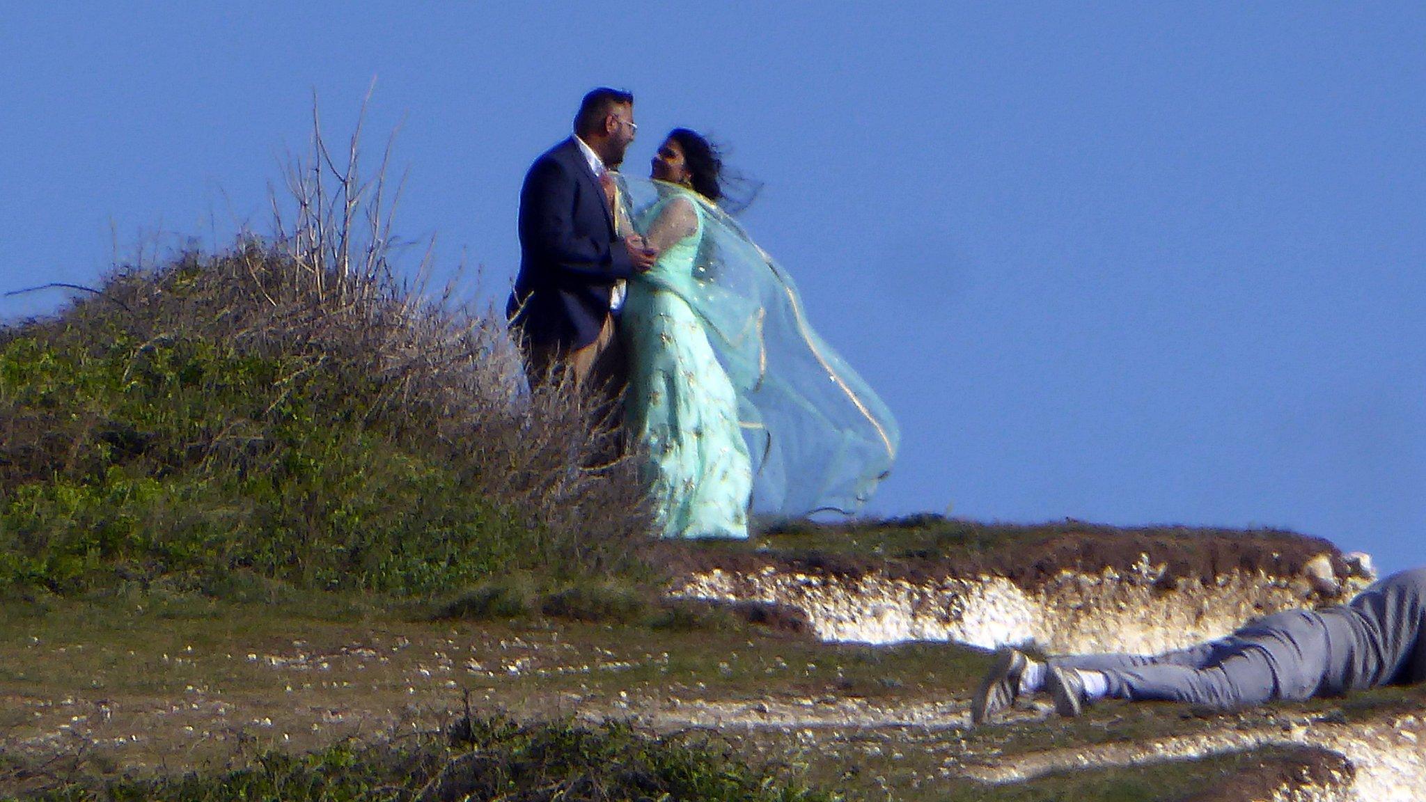 Couple on cliff edge