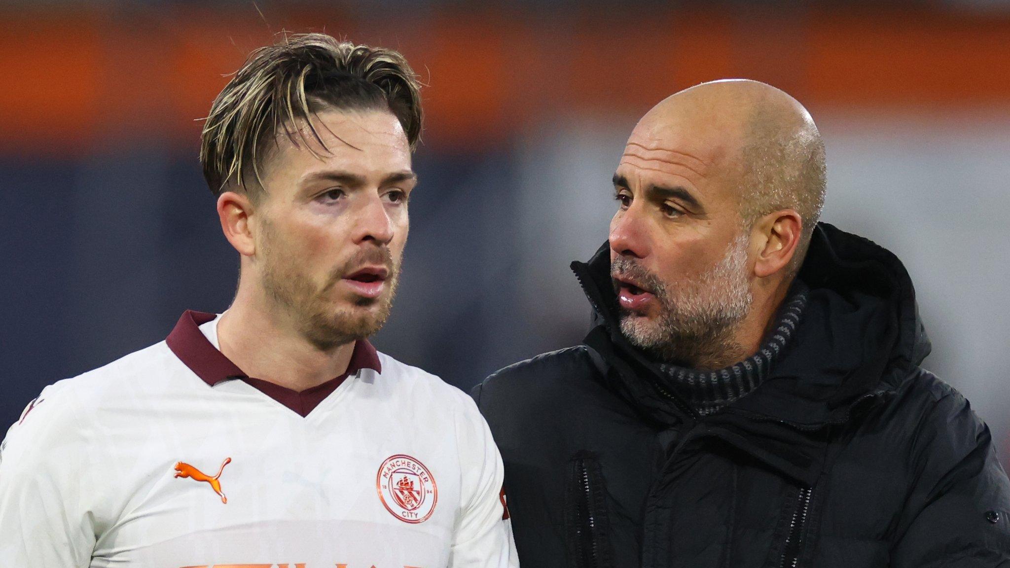 Manchester City winger Jack Grealish with manager Pep Guardiola