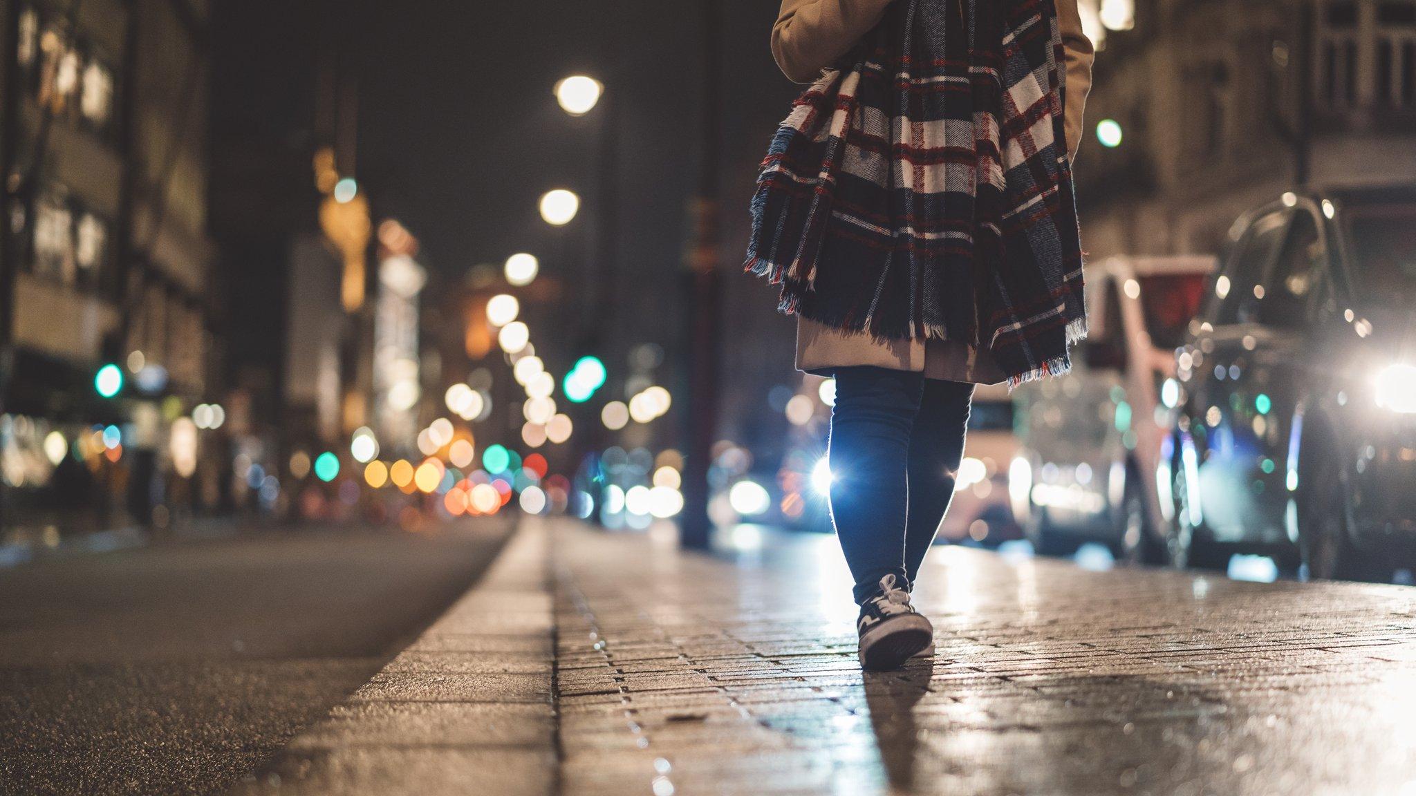 Young woman at Piccadilly Circus at night