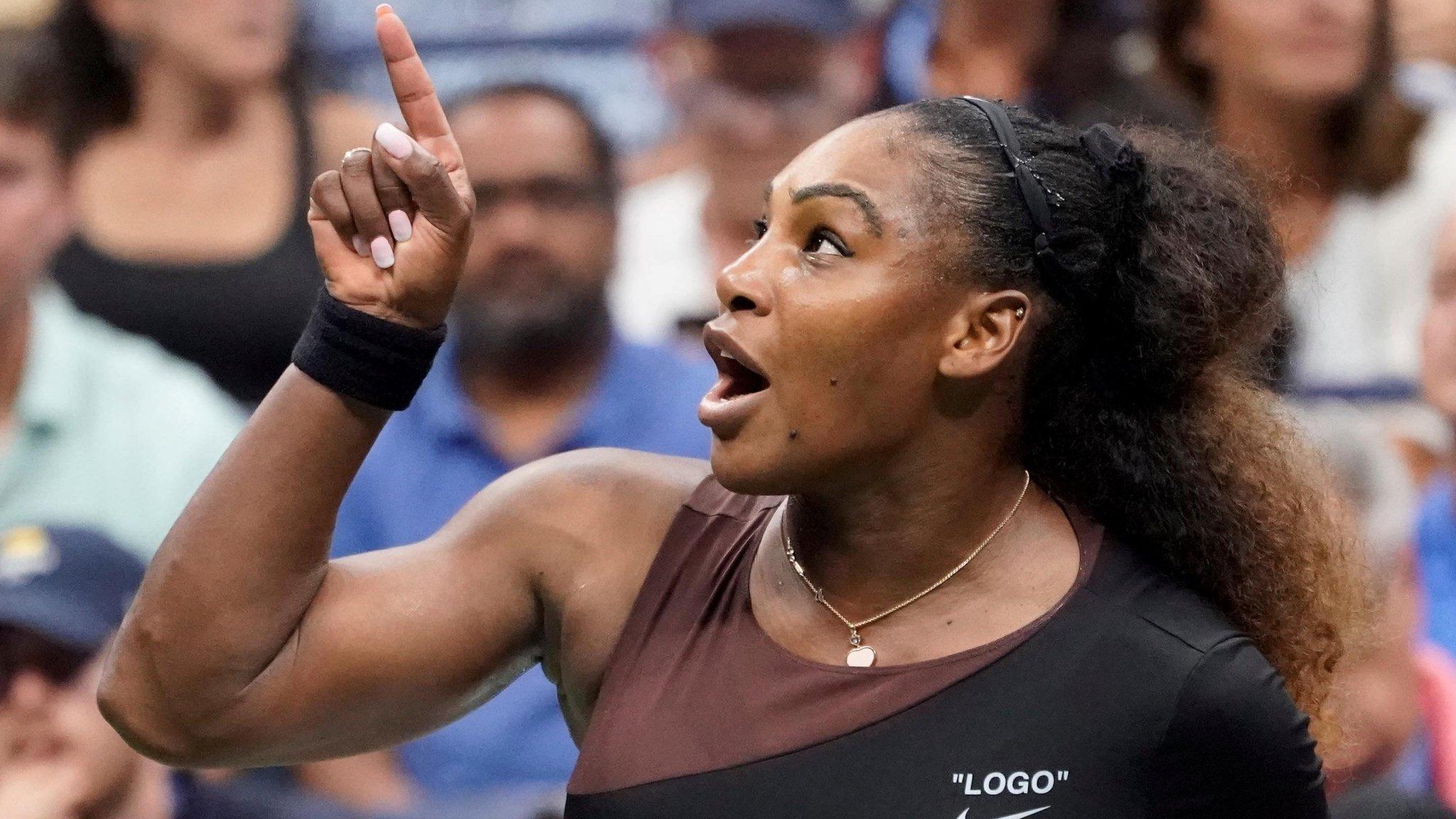 Serena Williams pointing at the chair umpire