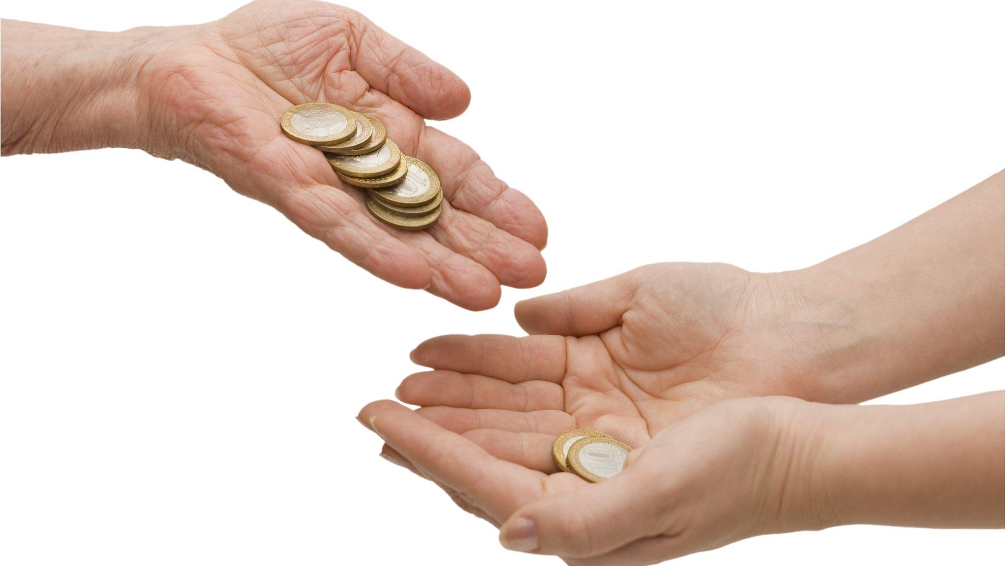 Hands holding coins