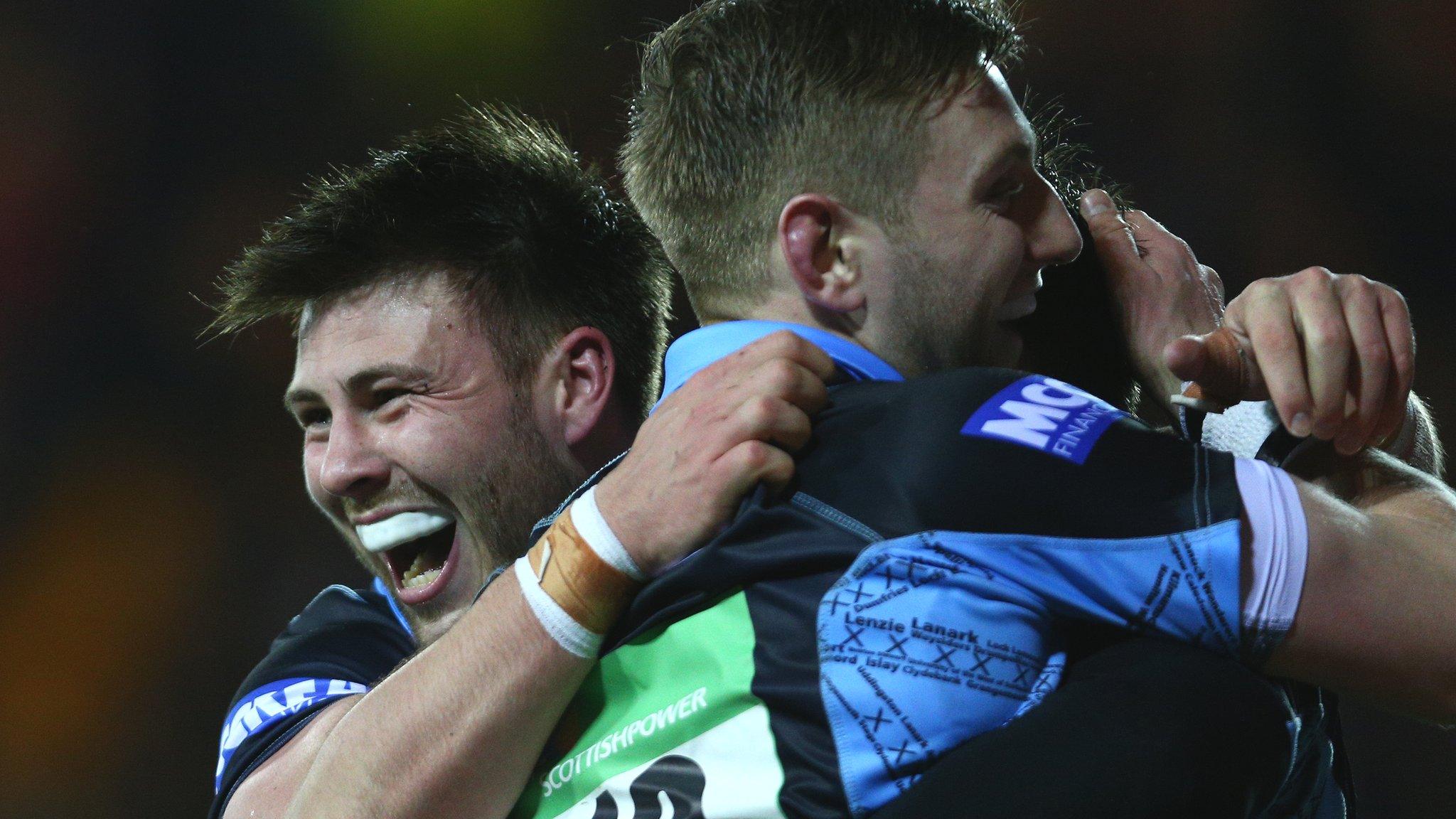 Glasgow half-backs Ali Price and Finn Russell celebrate a try against Racing 92