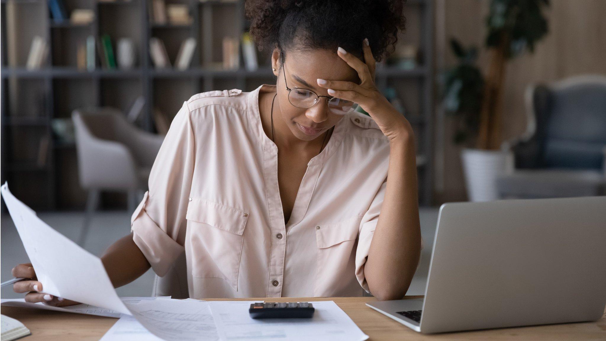 Woman looking at bills