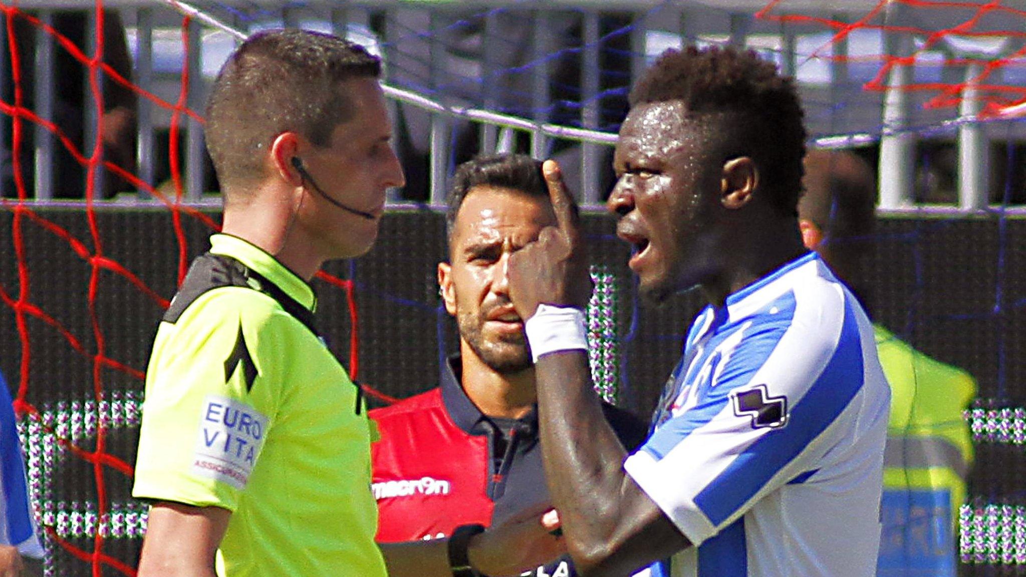 Sulley Muntari (right) speaks with referee Daniele Minelli