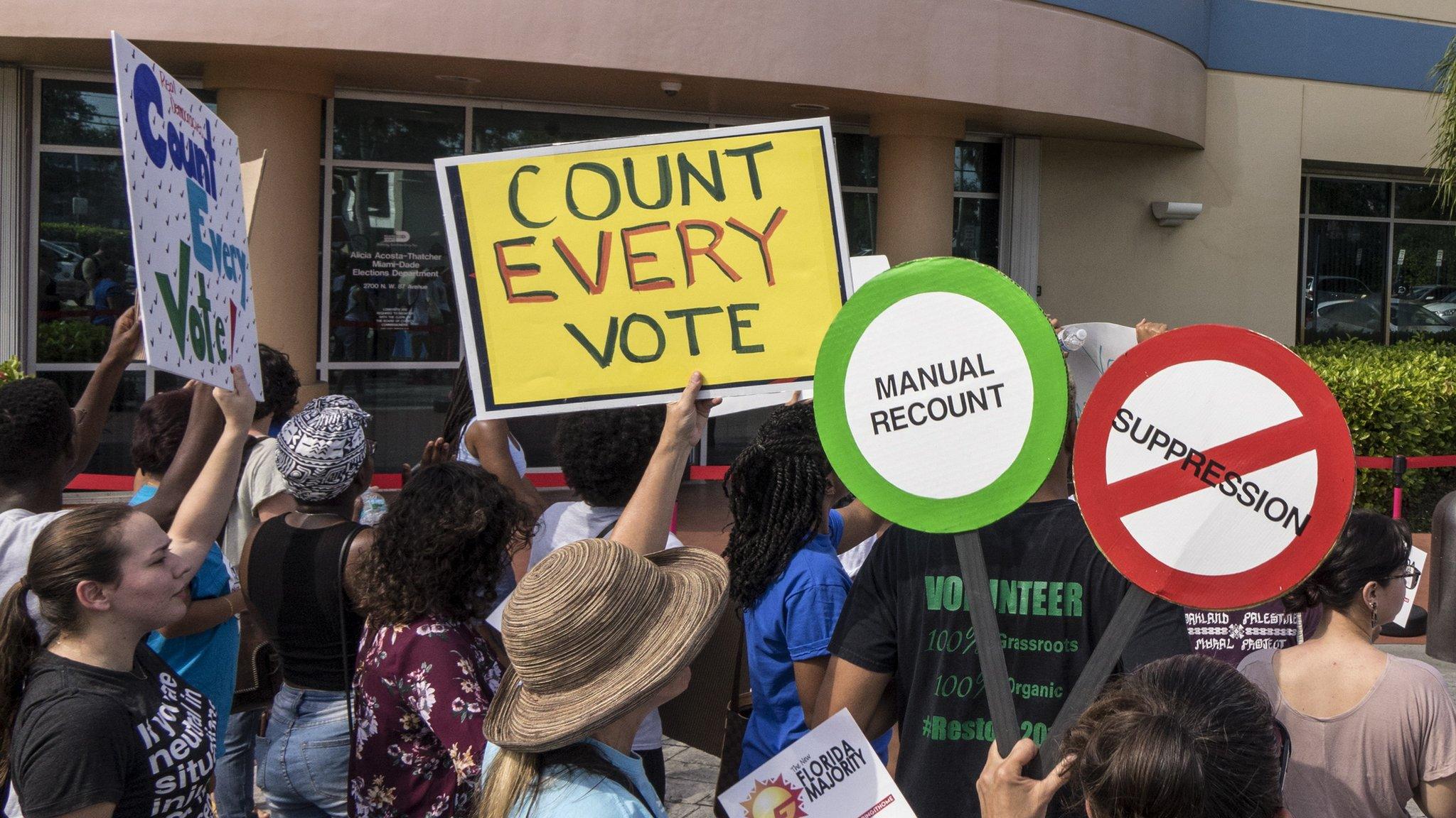 A crowd protests to demand a vote recount in Miami, Florida