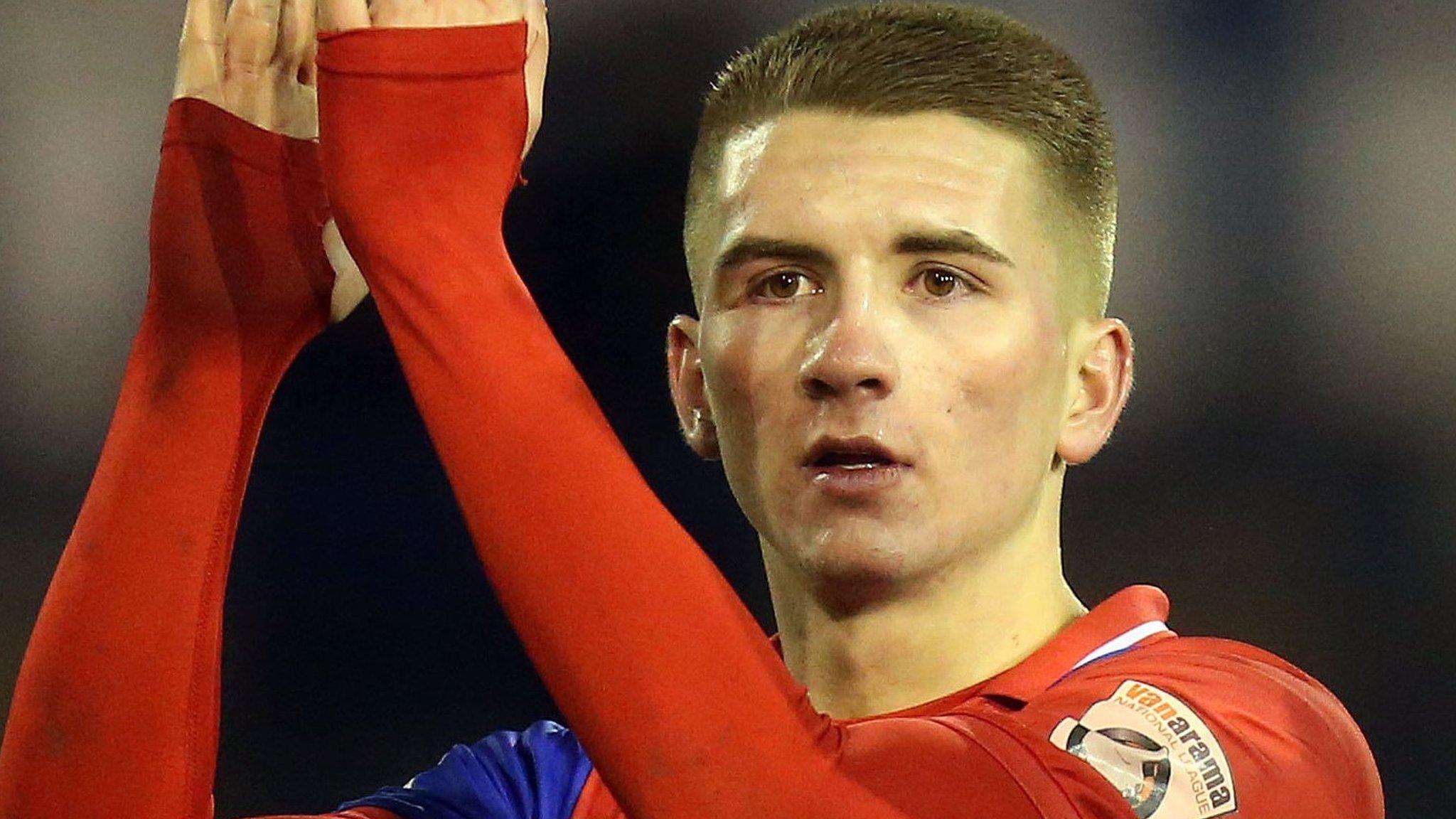 Sam Ling applauds Dagenham's fans after a match