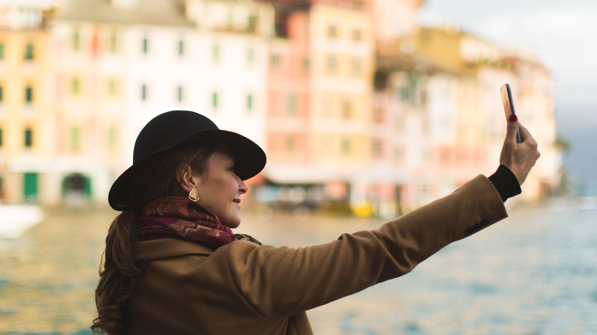 Woman taking selfie in Portofino