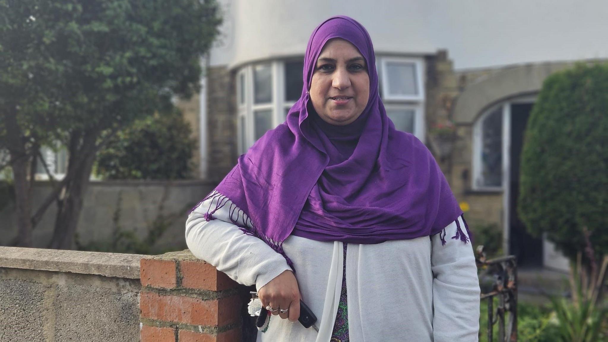 Ghazala Saleem standing in front of her home in Heaton, Bradford