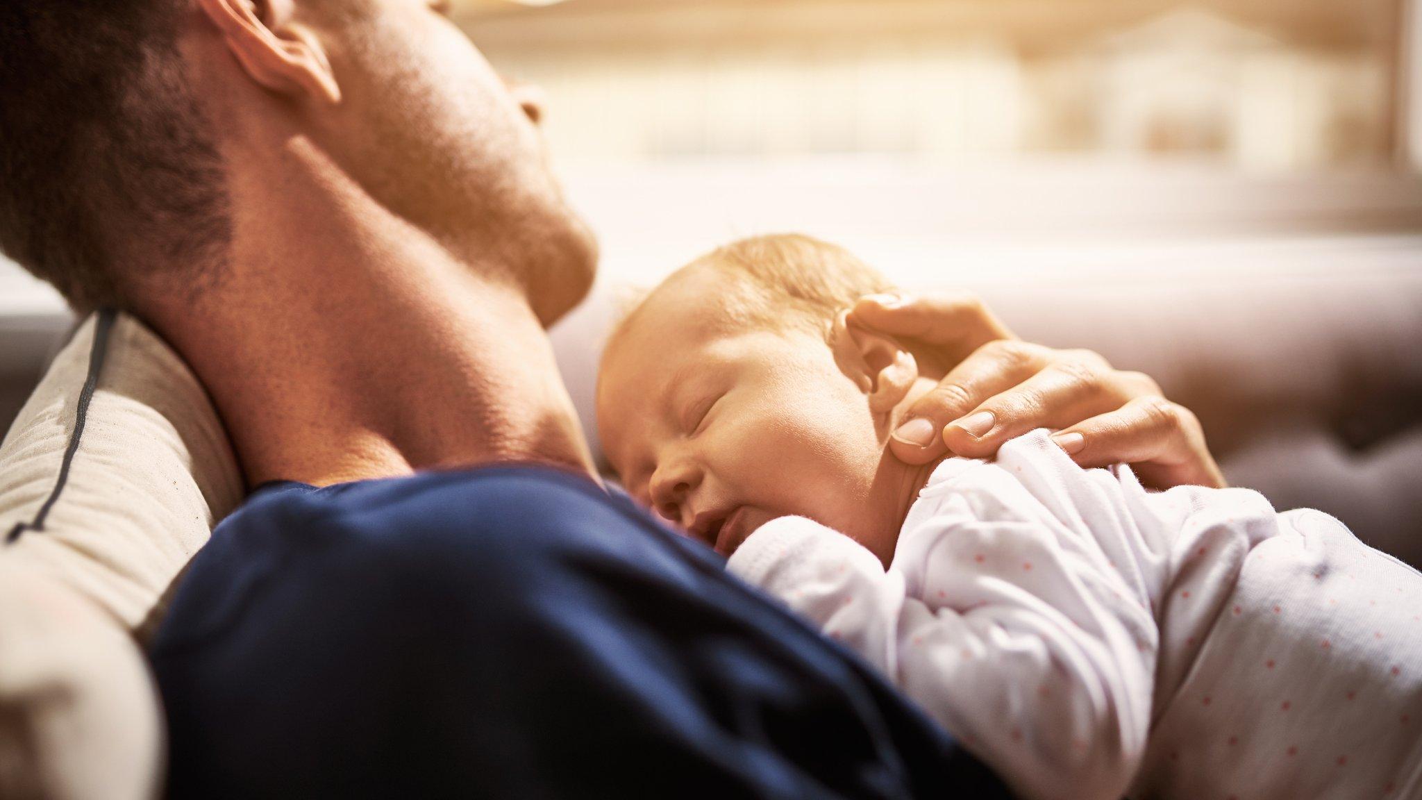 A man holding a baby