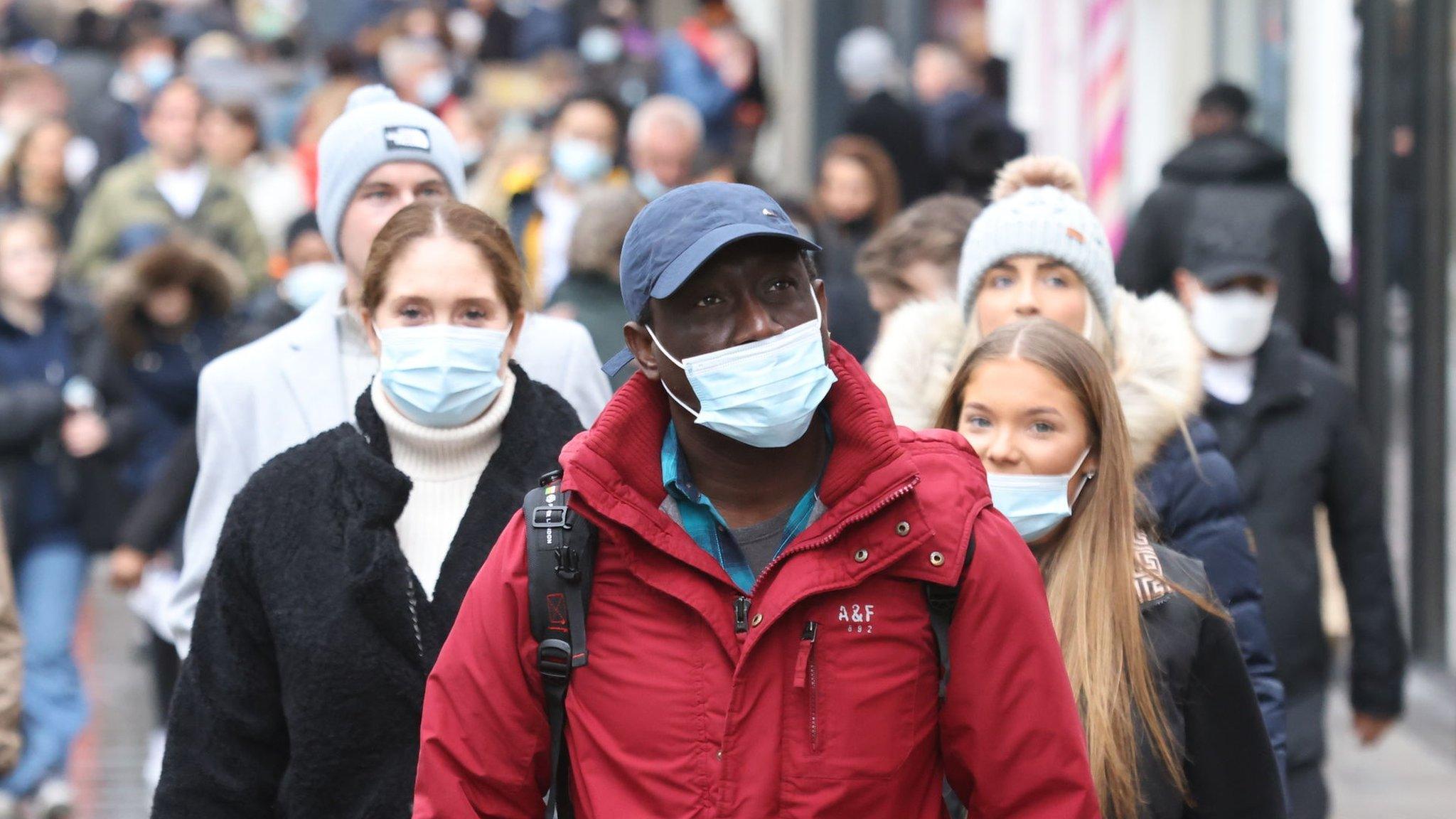 People wearing masks out shopping in London