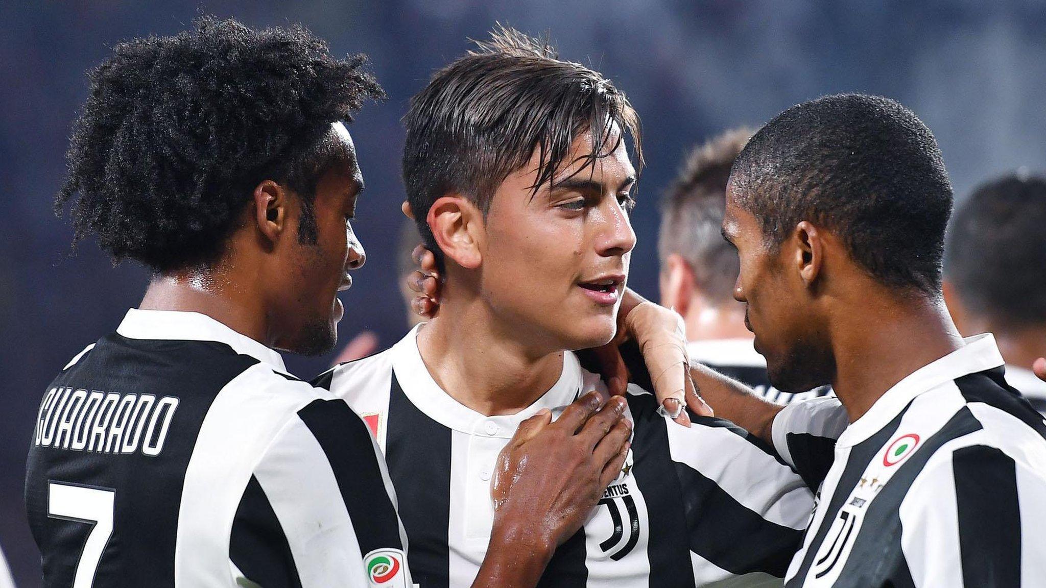 Juventus players celebrate scoring against Torino