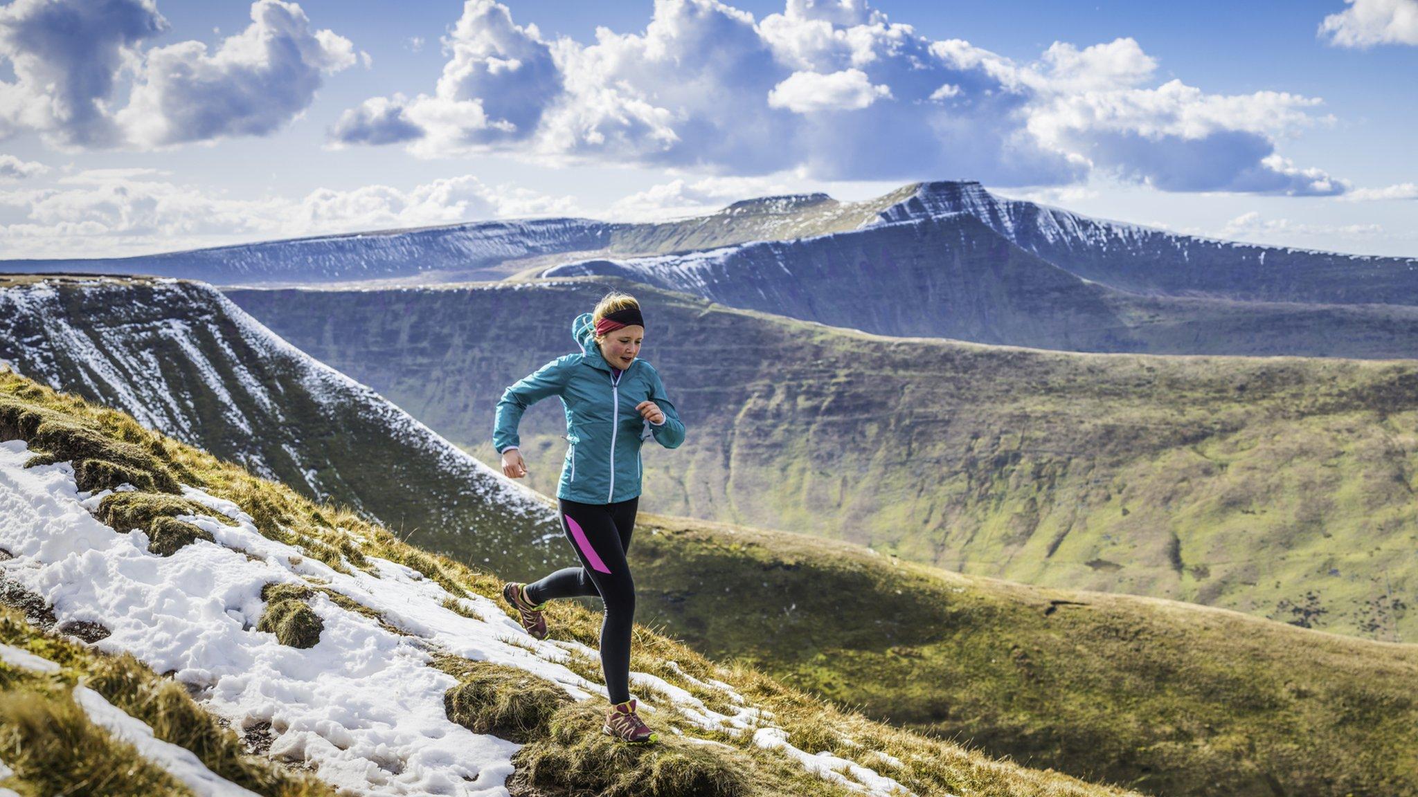 woman running in mountains