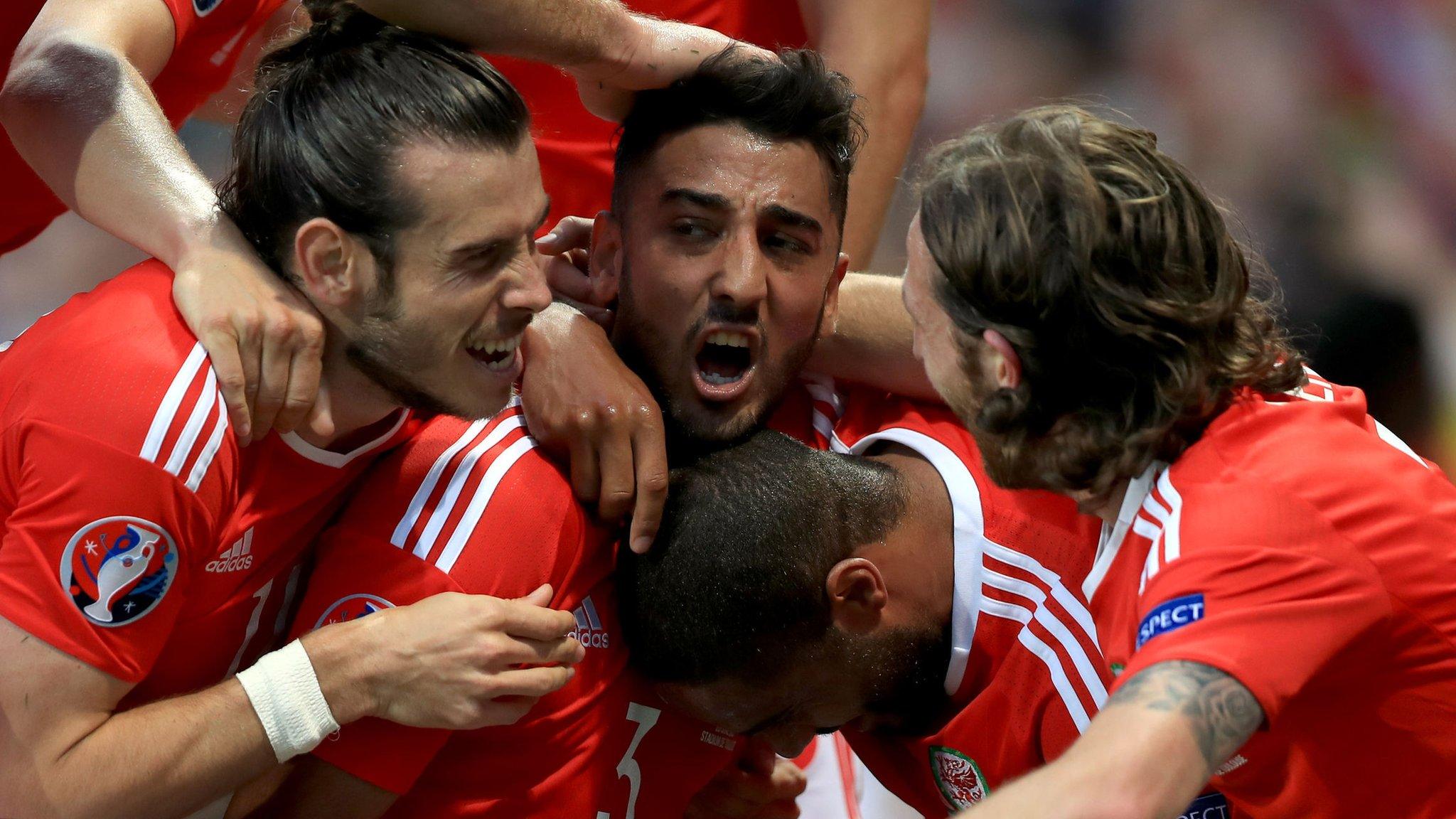 Wales' players celebrate scoring against Russia