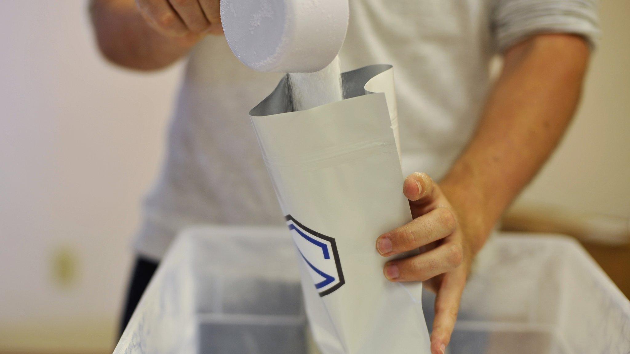 Pouring soylent into a bag