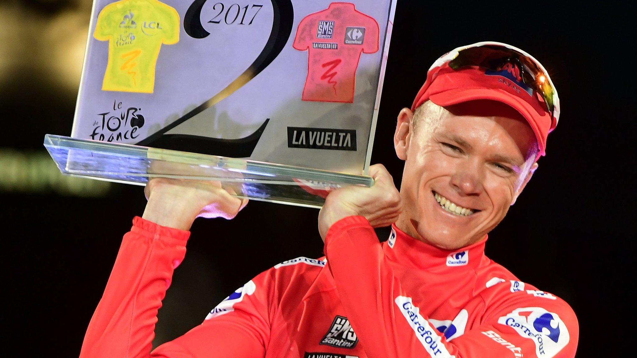 Chris Froome with trophy commemorating his 2017 Tour de France and Vuelta a Espana victories