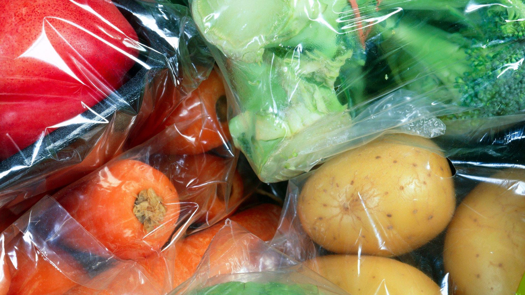 Vegetables individually wrapped in plastic cellophane.