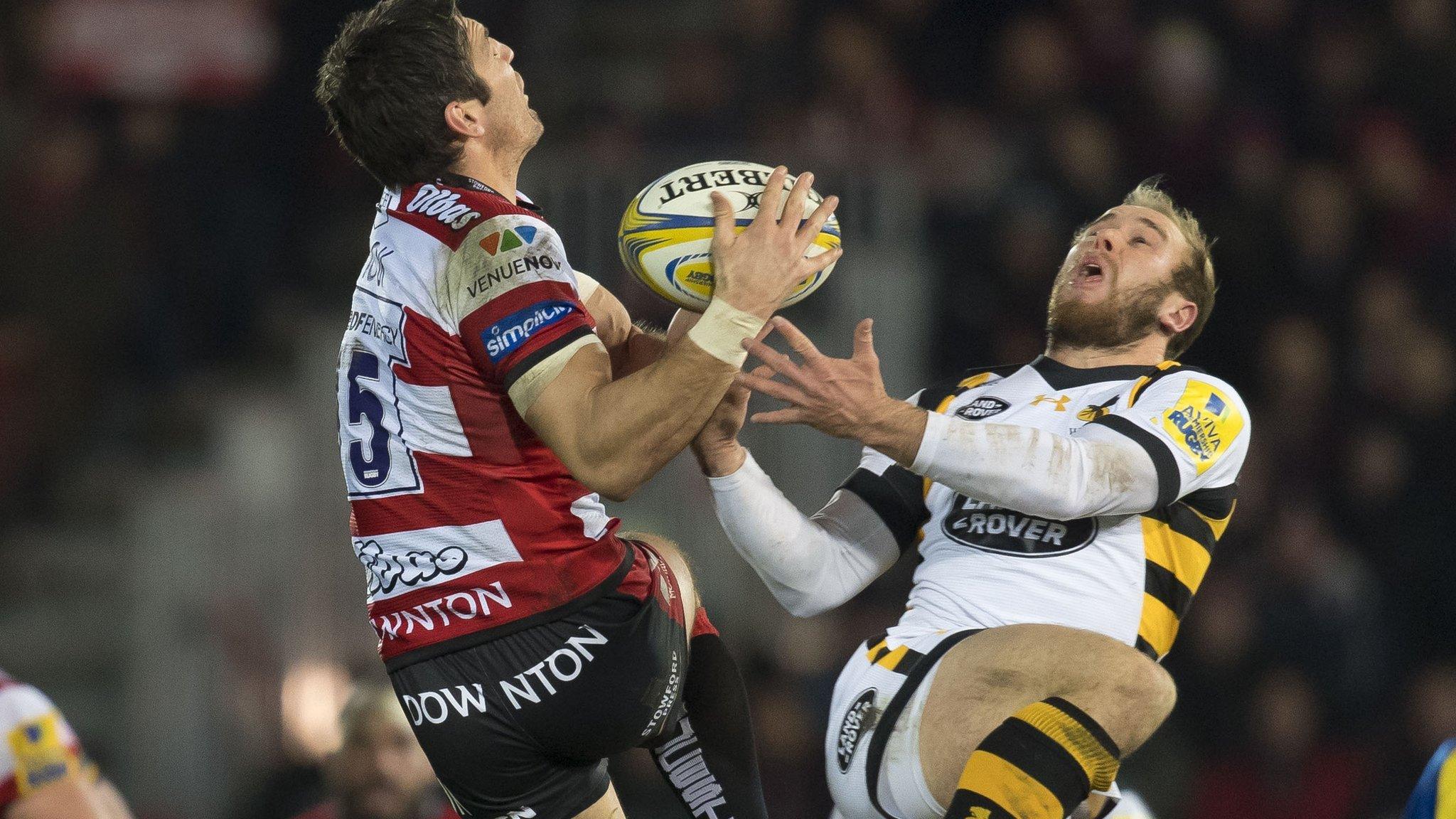 James Hook of Gloucester Rugby (L) and Dan Robson of Wasps in action