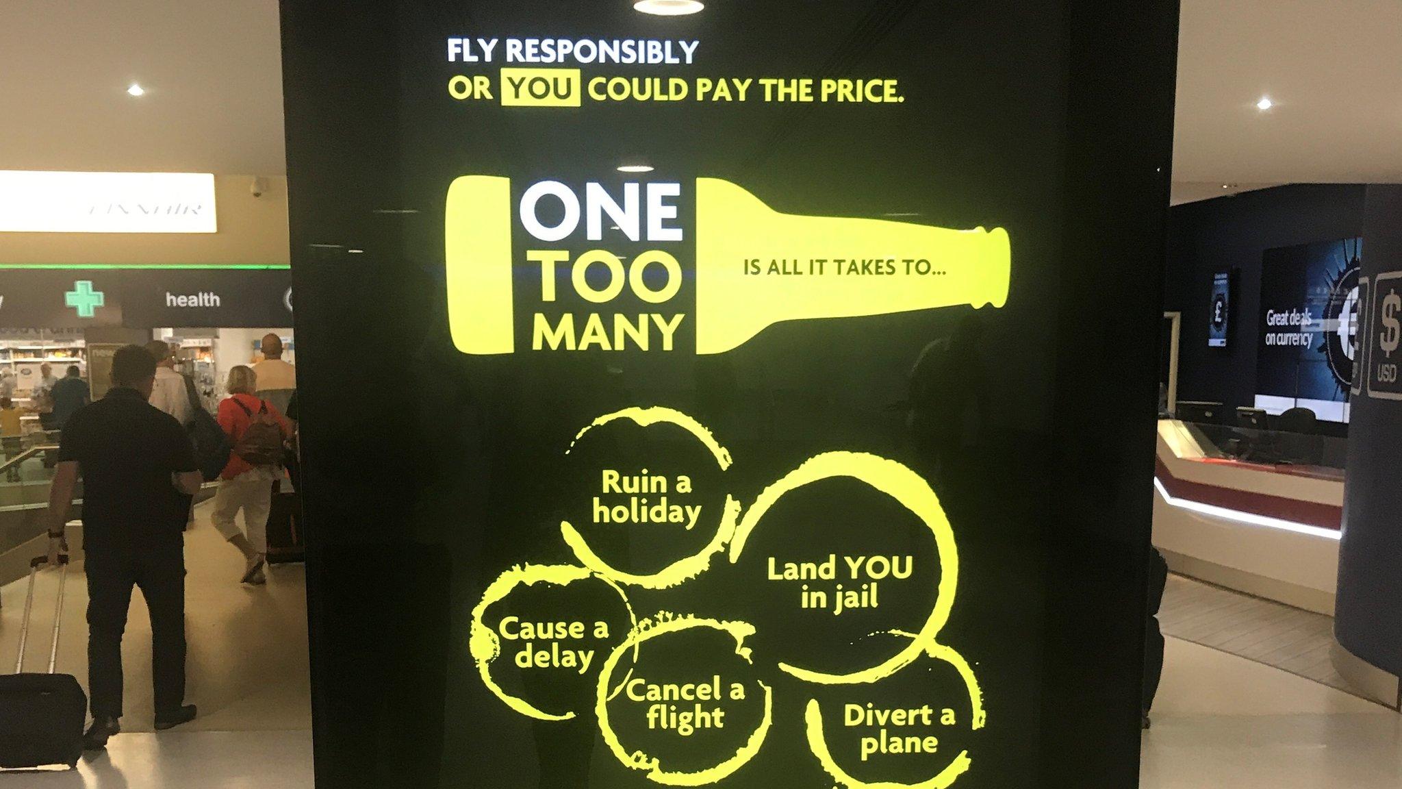 One Too Many campaign on screen at Manchester airport