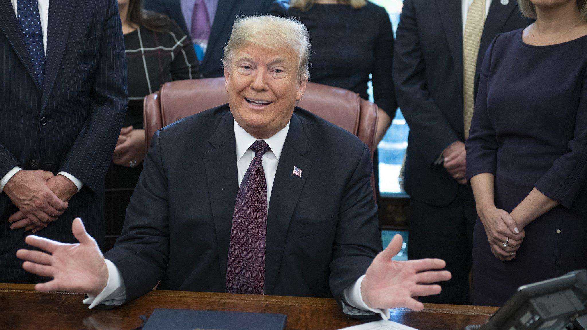 US President Donald J. Trump gestrure during the signing of the Cybersecurity and Infrastructure Security Agency Act in the Oval Office of the White House in Washington, DC, USA, 16 November 2018.