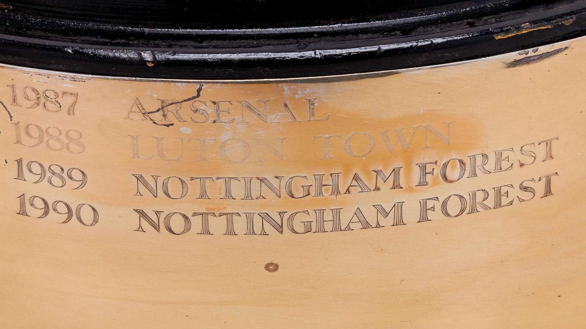Inscription on the trophy lists four consecutive years between 1987 and 1990 and next to them are team names: Arsenal, Luton Town and then Nottingham Forest twice.