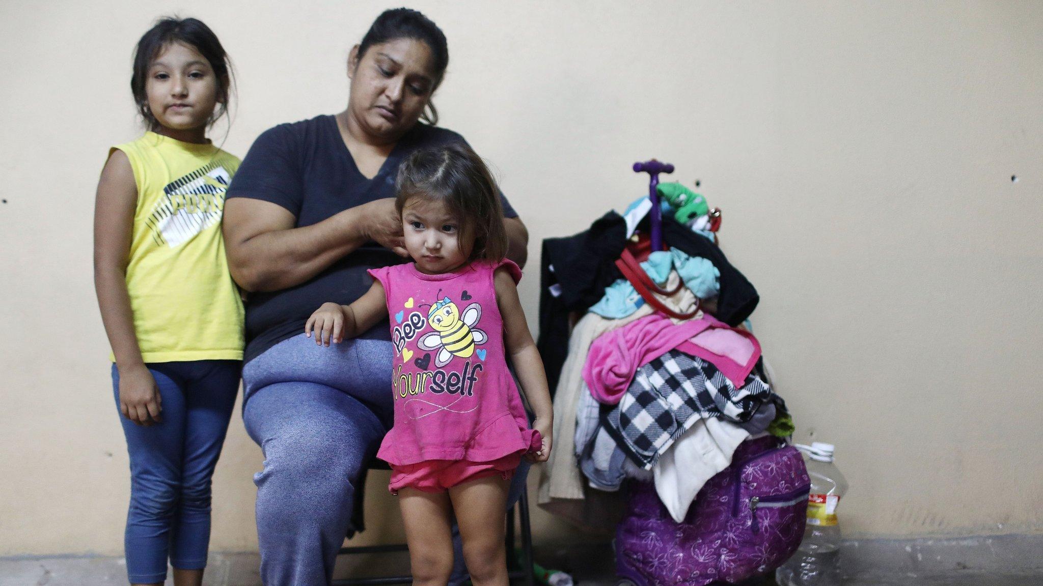 Migrant mother poses with children in a shelter in Tijuana, Mexico - 20 June