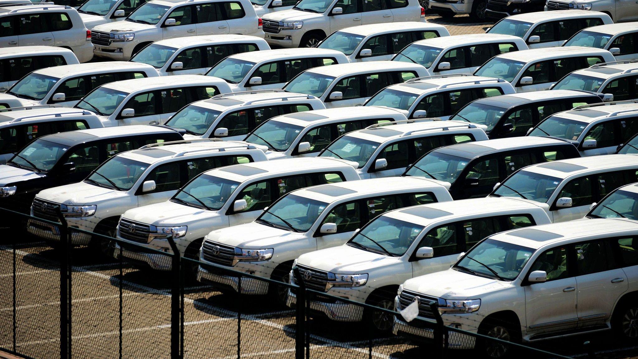 Imported cars are seen parked at a parking lot near a port in Qingdao, east China's Shandong province on April 17, 2017.