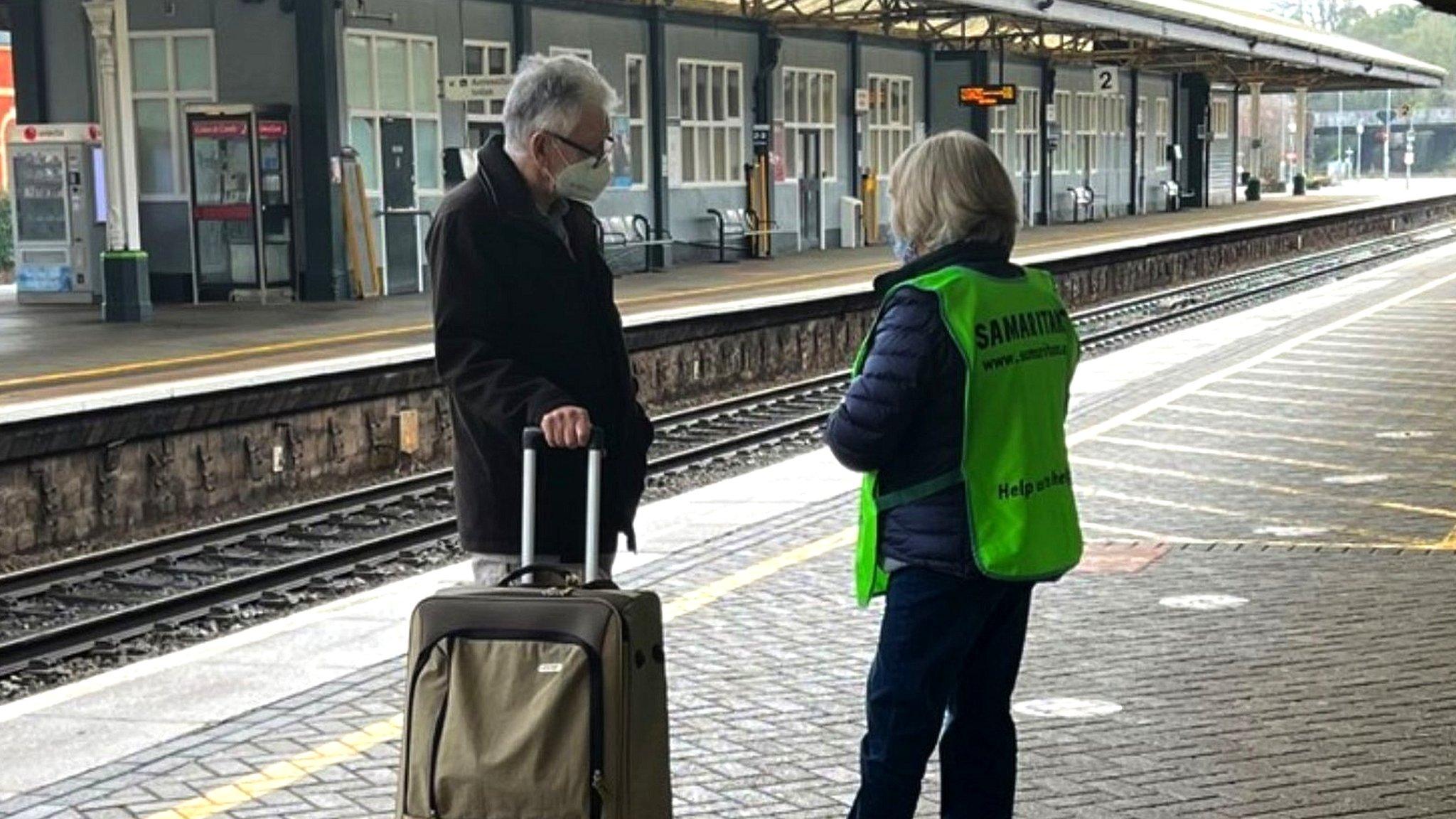 Samaritans volunteer talking to passenger