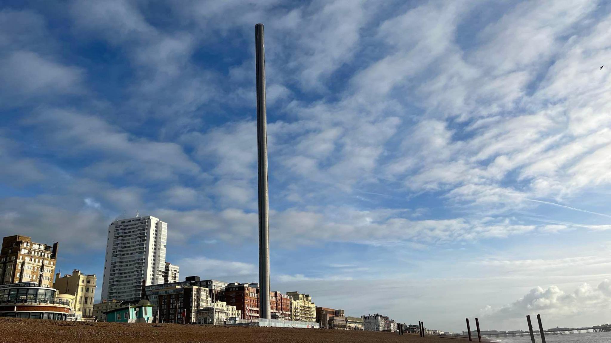 The long needle of the i360 is without its viewing platform with a backdrop of the Brighton seafront