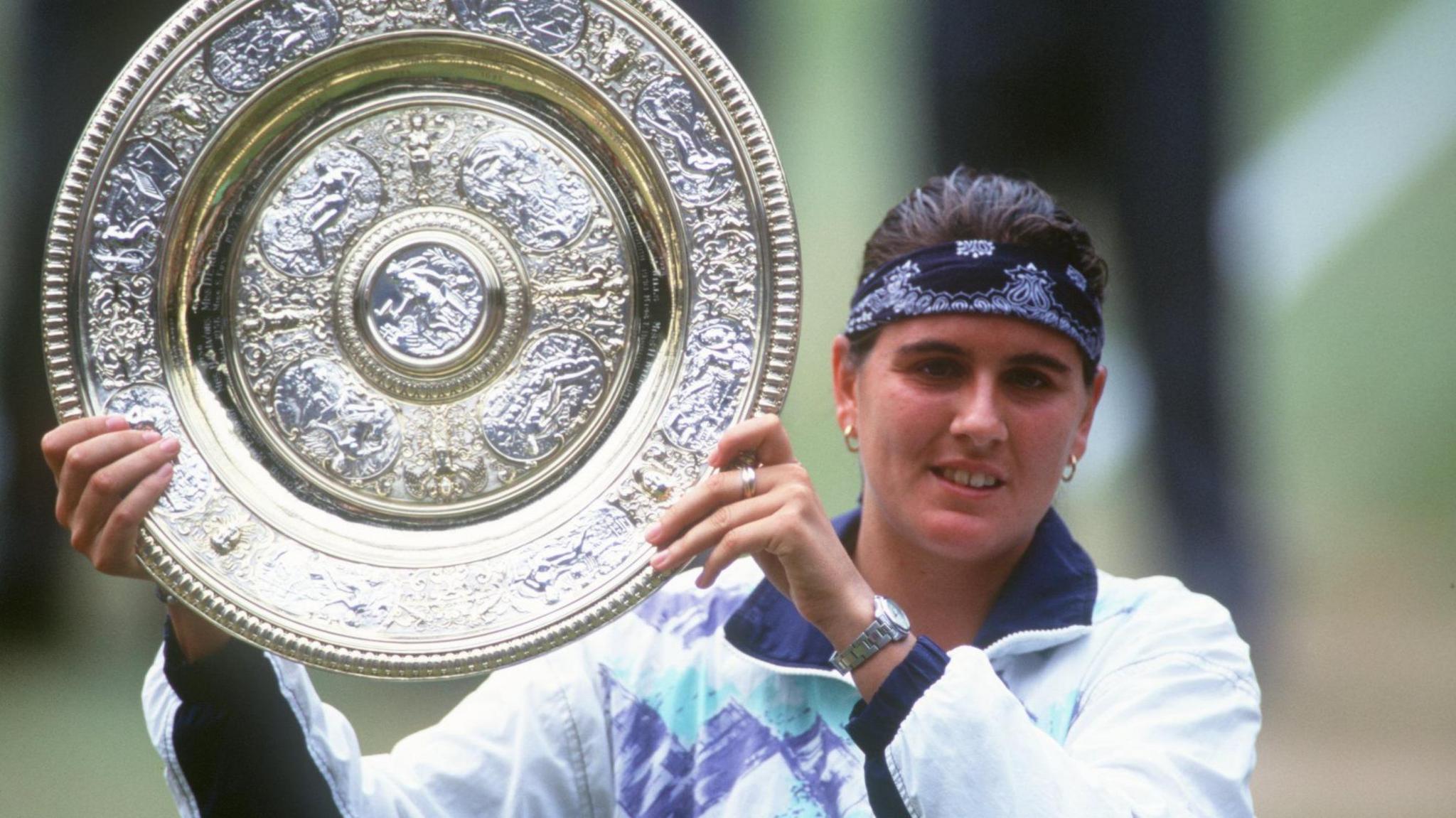 Conchita Martinez lifts the Wimbledon trophy in 1994