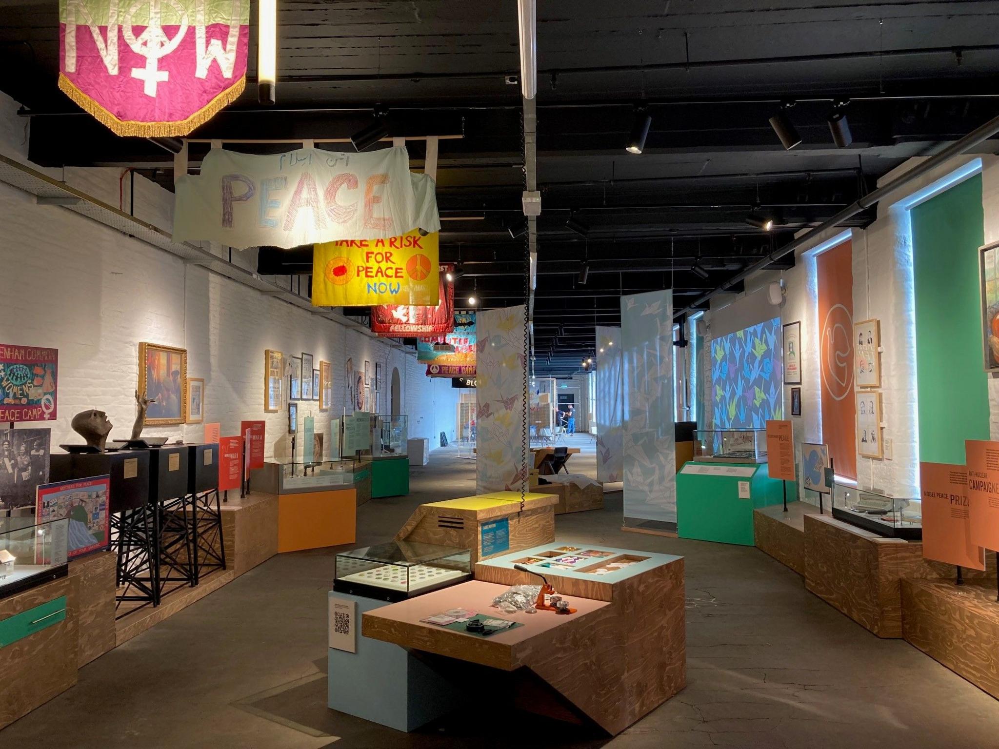 A shot of the interior of the new museum with peace banners hanging from the ceiling