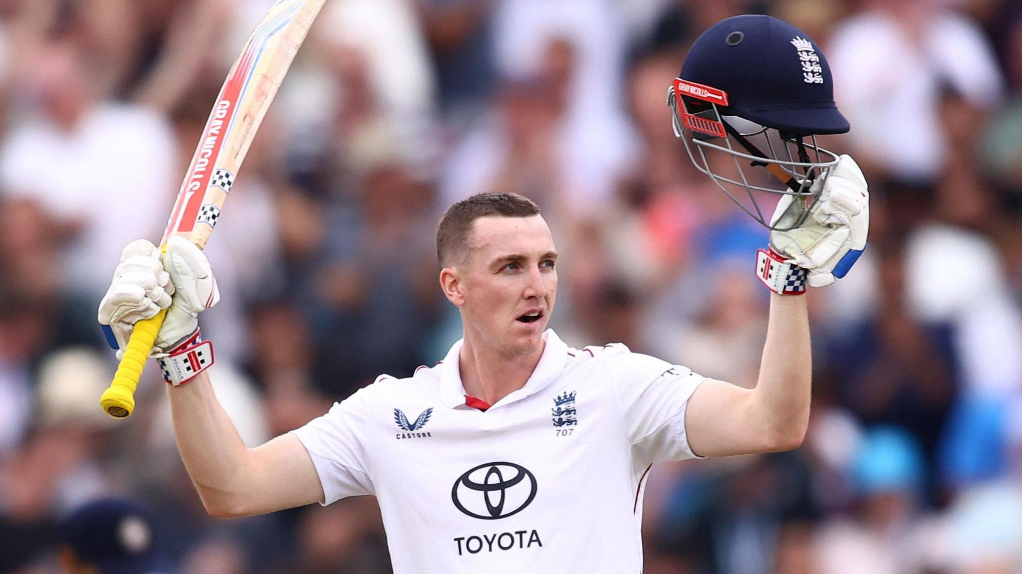 England batter Harry Brook raises his bat and helmet after hitting a century against India in the fifth Test