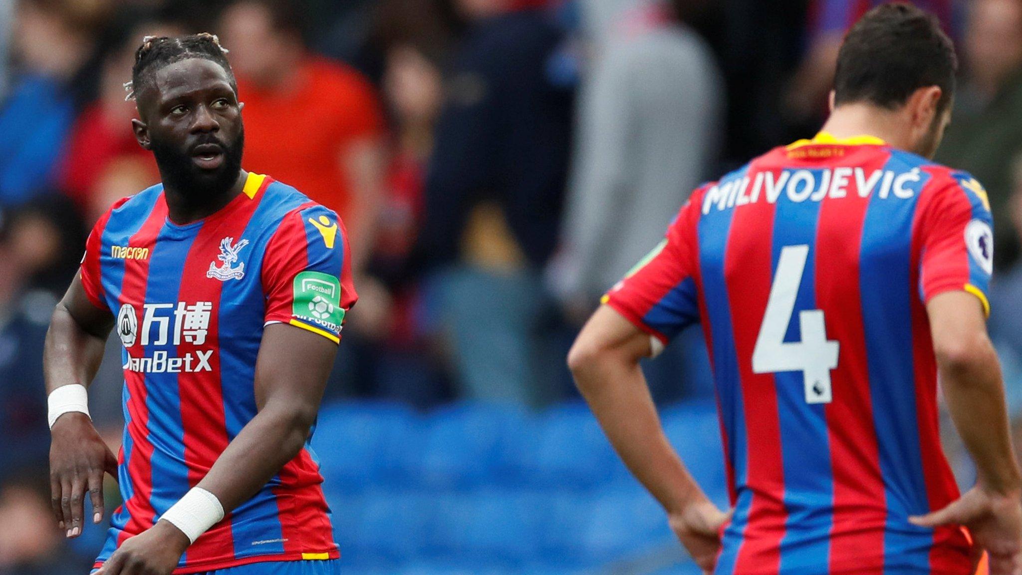 Bakary Sako and Luka Milivojevic dejected after the final whsitle