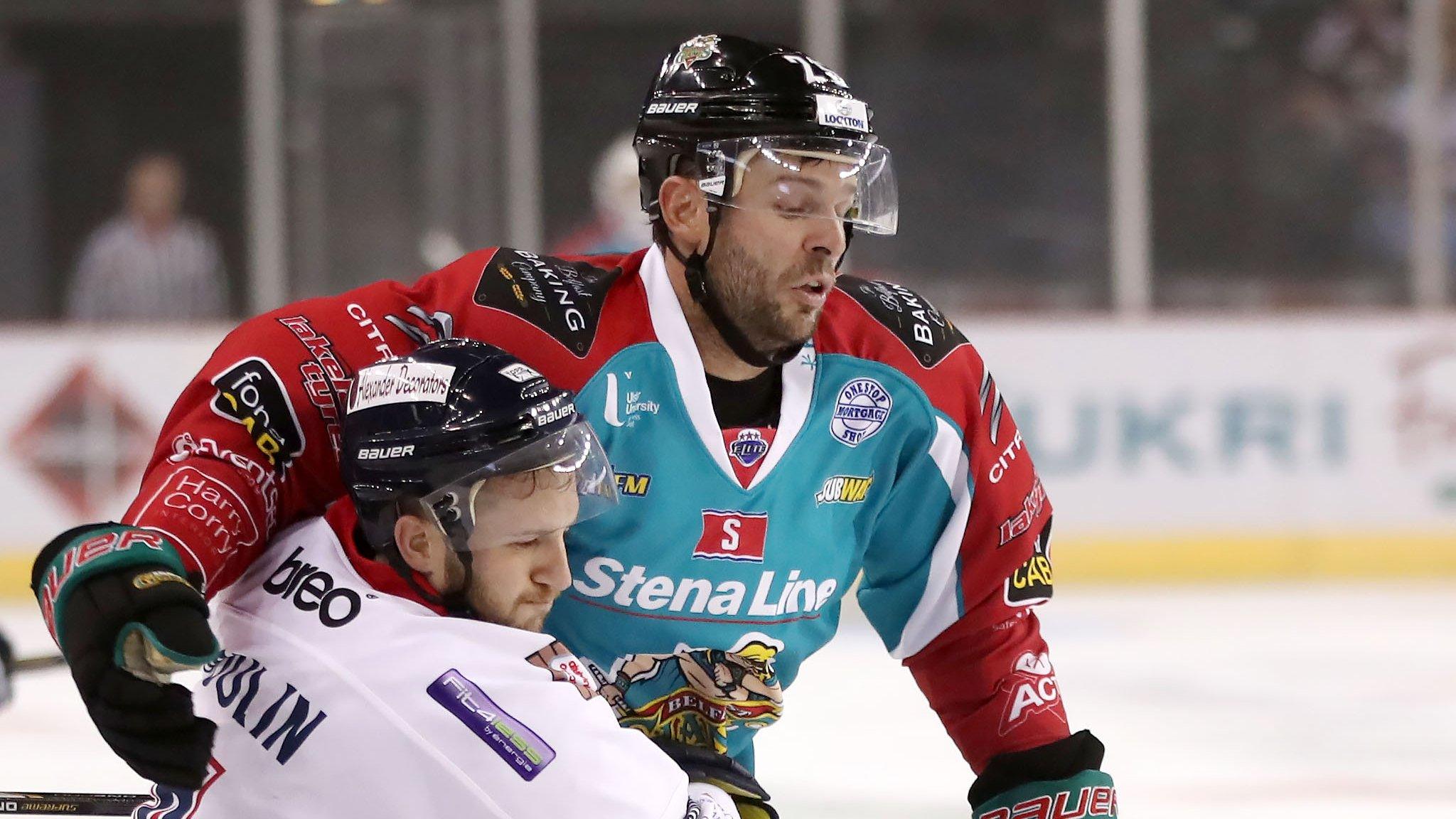 Blair Riley of the Belfast Giants battles with Dundee's Felix-Antoine Poulin in Saturday's Challenge Cup game at the SSE Arena