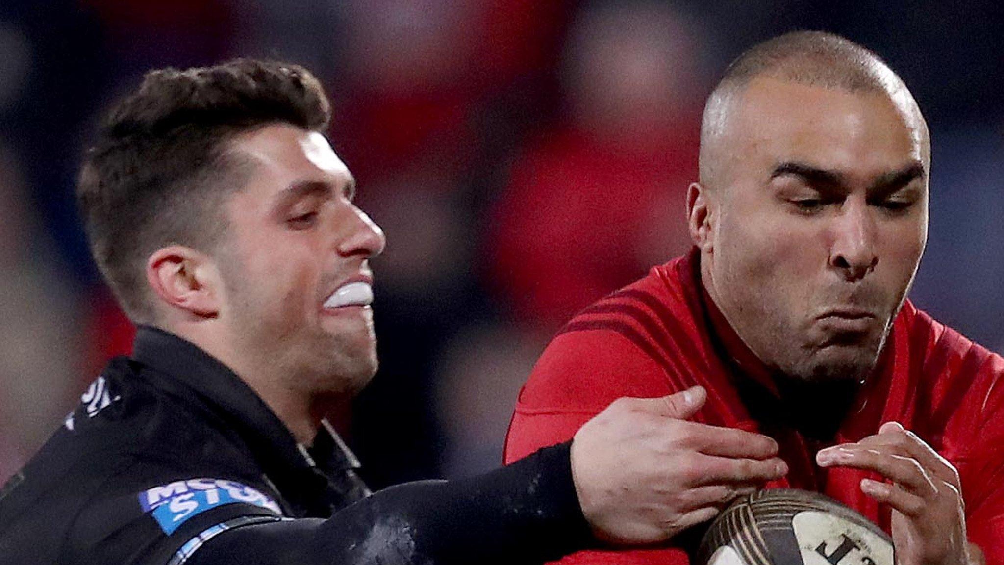 Munster's Simon Zebo with Adam Hastings of Glasgow