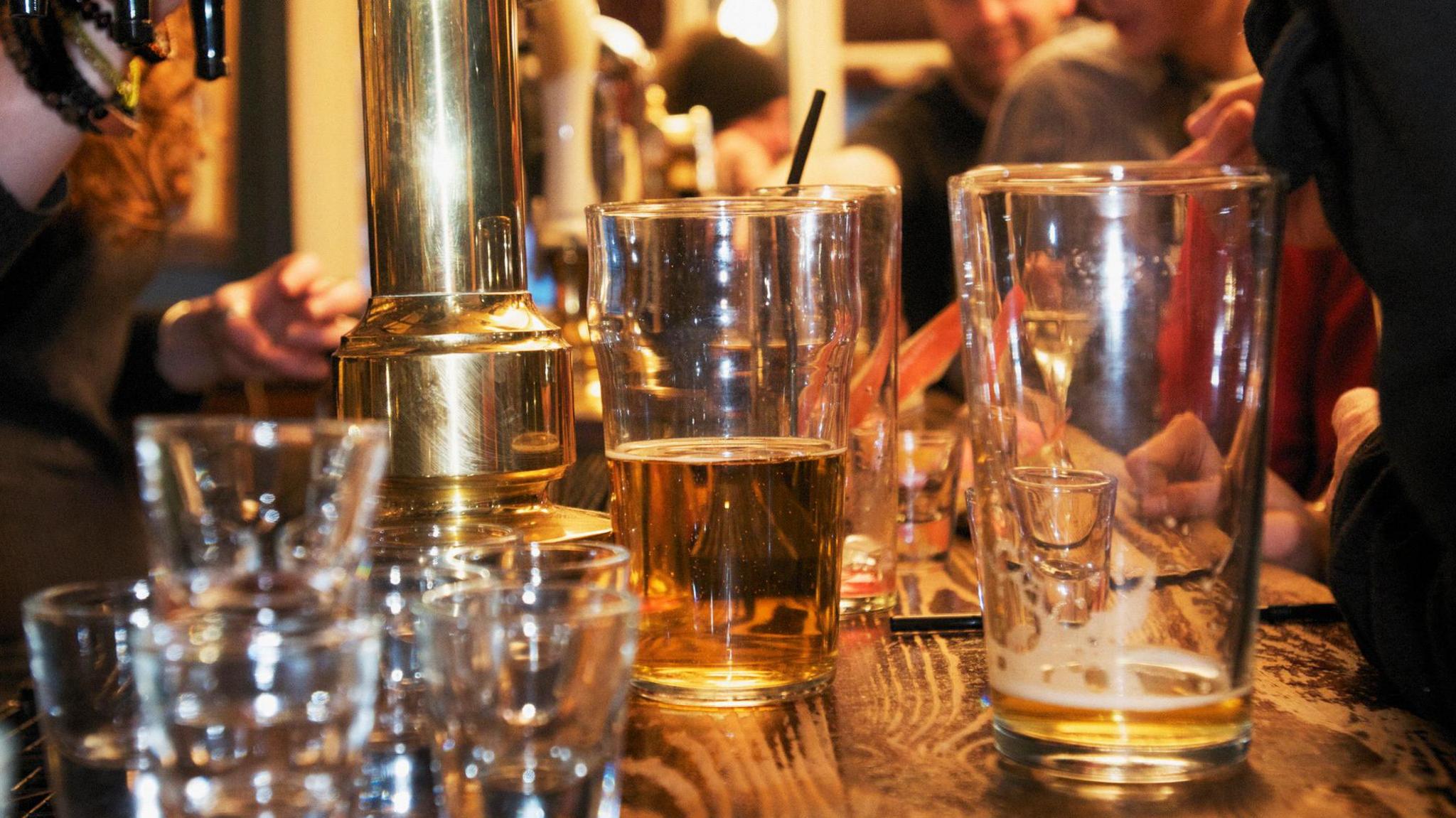 Empty glasses sitting on a bar