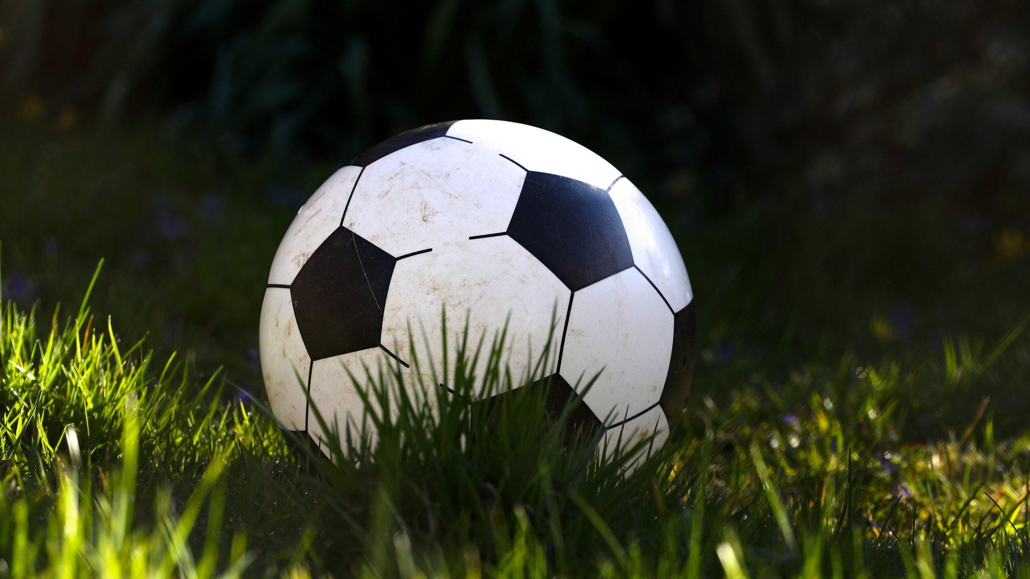 A football in the grass