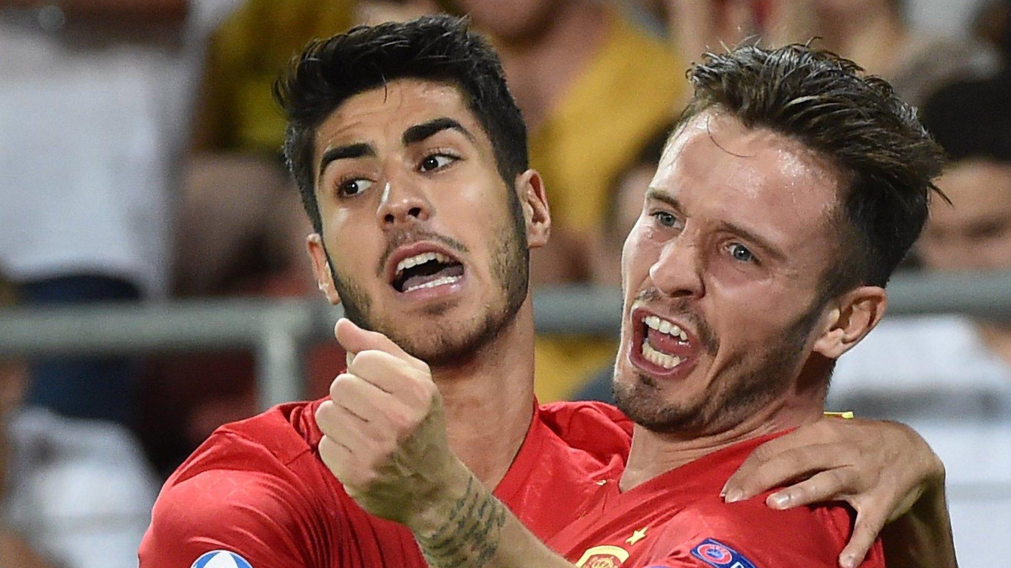 Marco Asensio and Saul Niguez celebrate