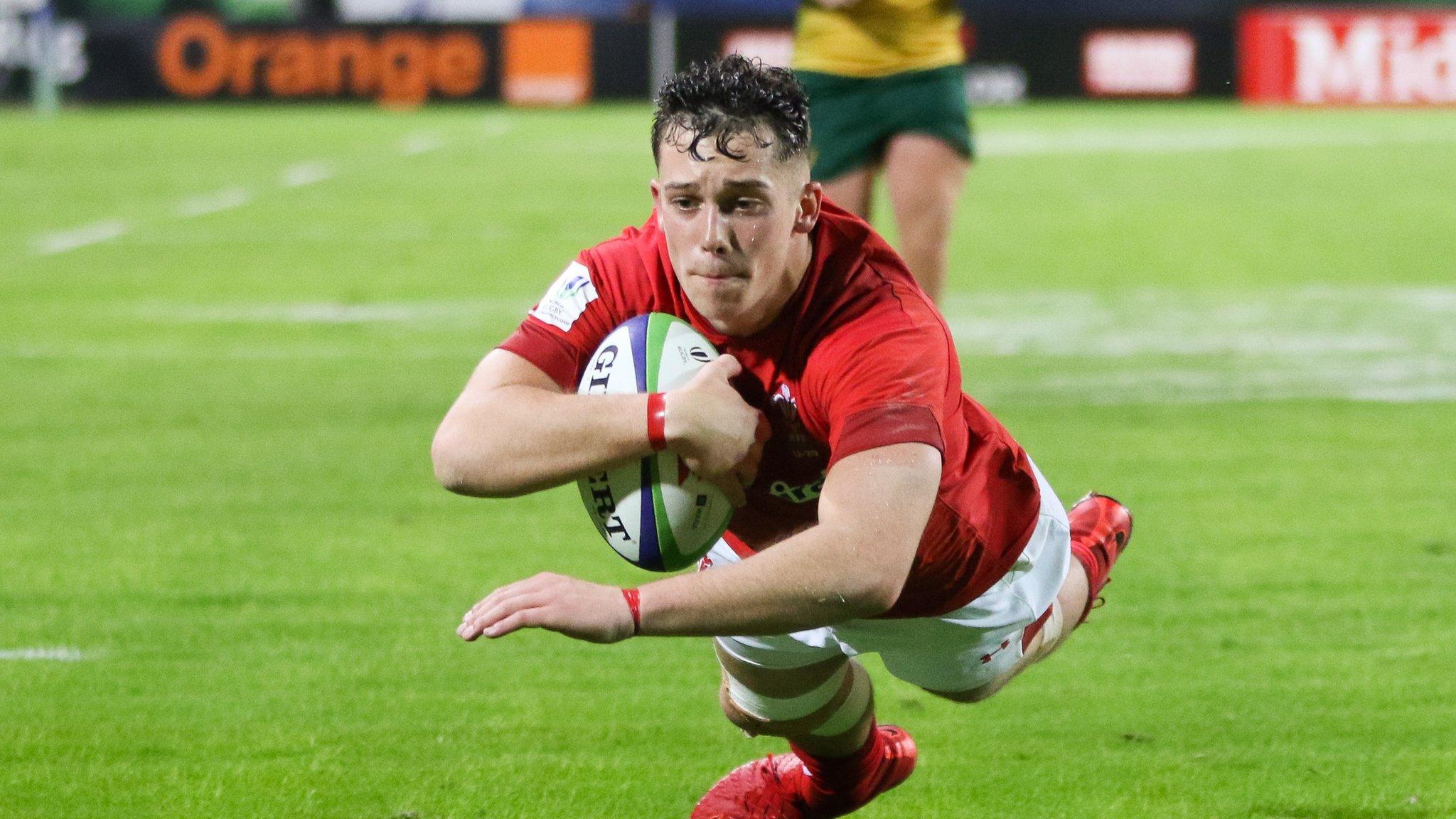 Joe Goodchild of Wales dives in to score try