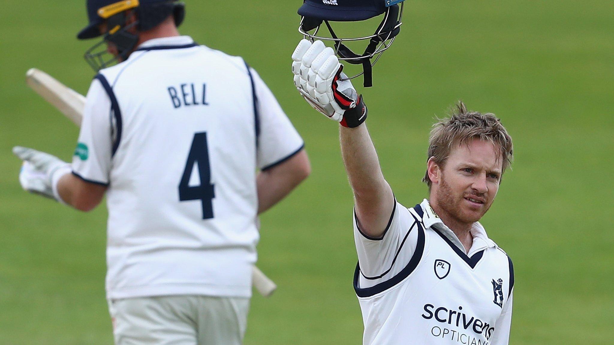 Warwickshire opener Ian Westwood is applauded on reaching the 16th first-class century of his career by Bears captain Ian Bell