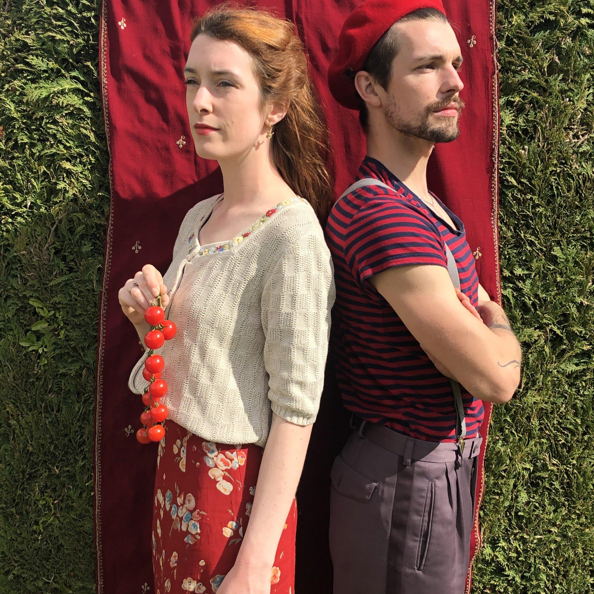 Helen Yang and Thomas Etheridge in red outfits