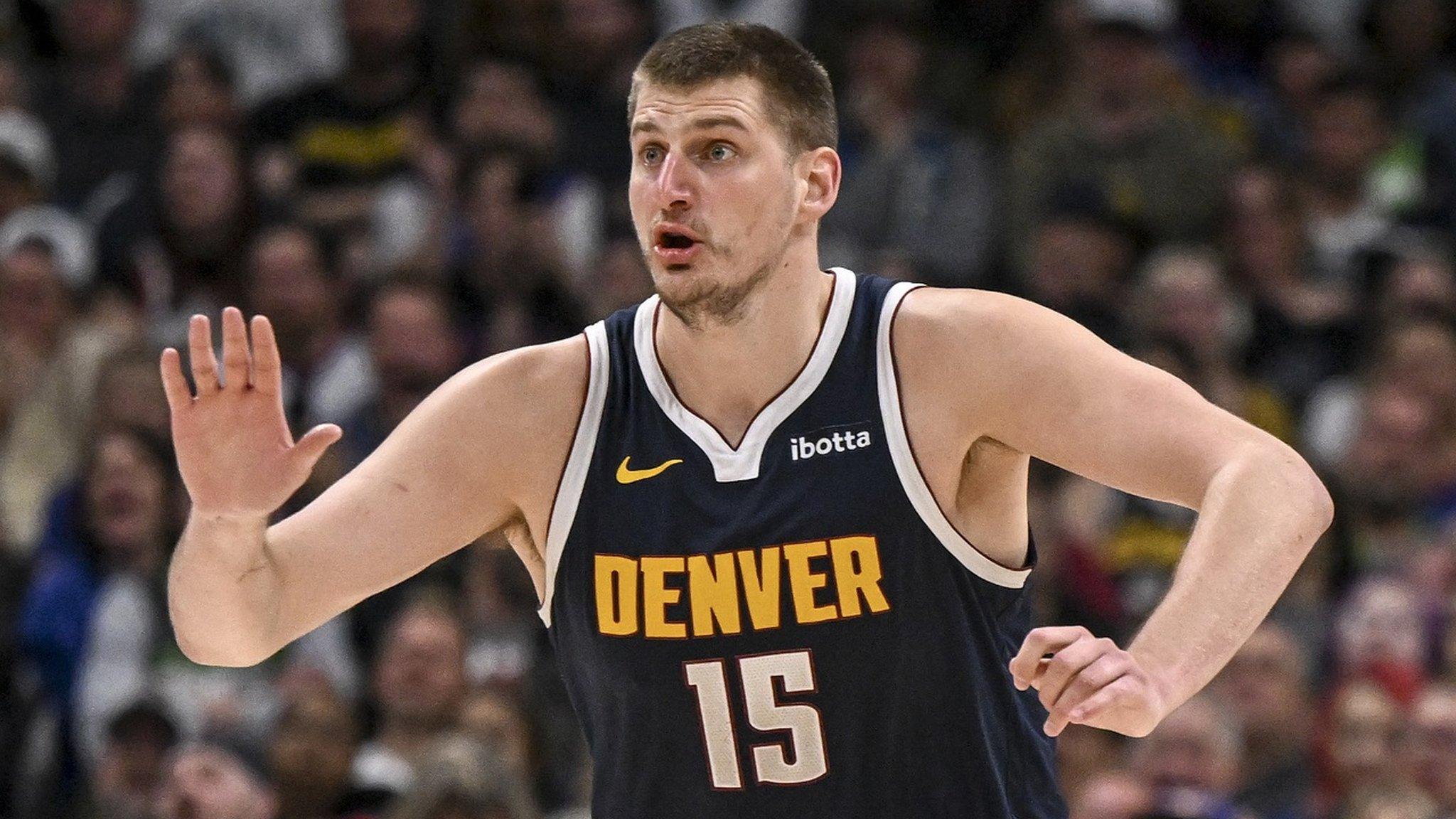 Denver Nuggets star Nikola Jokic gestures for the ball