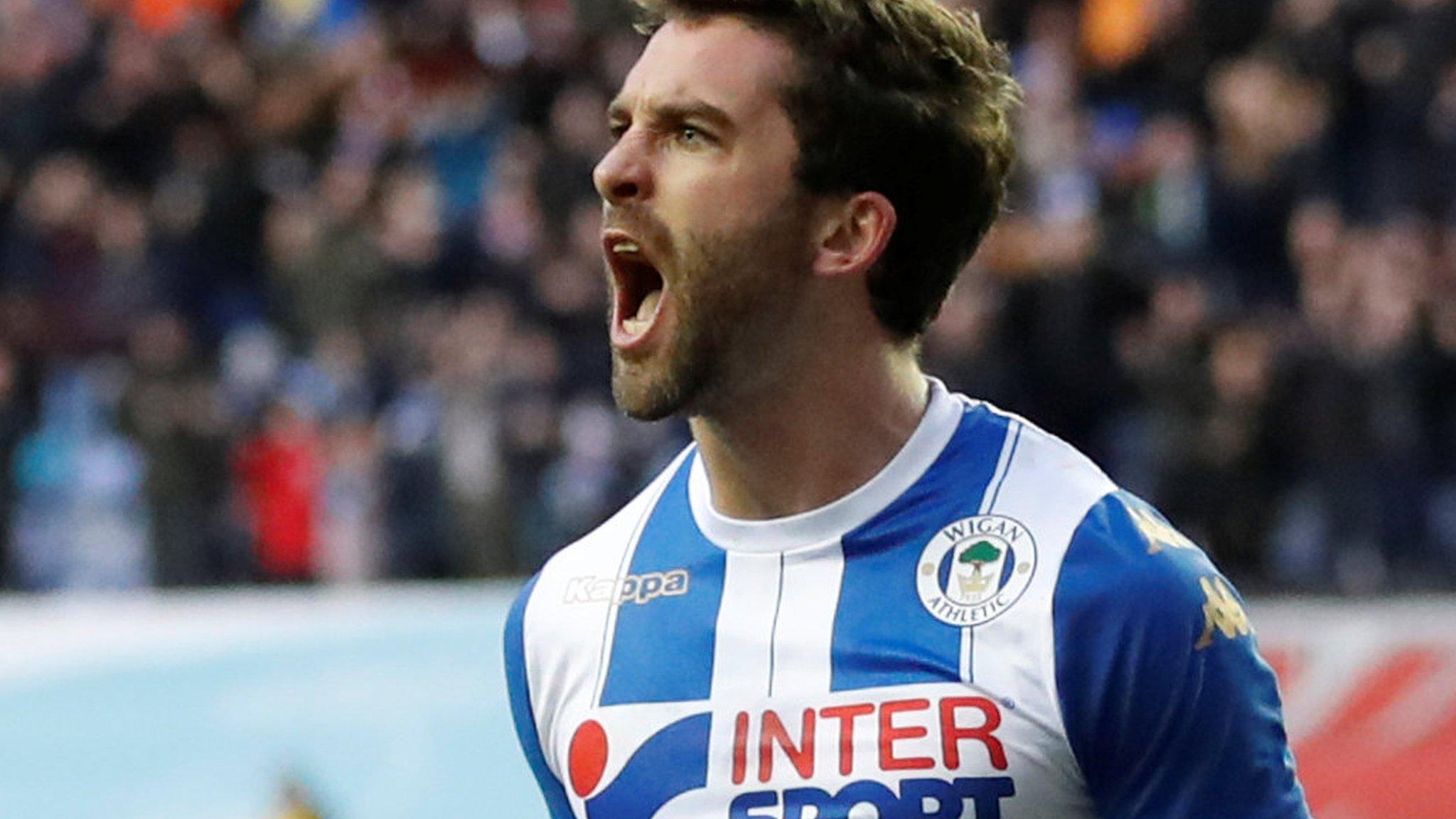 Will Grigg celebrates scoring against West Ham