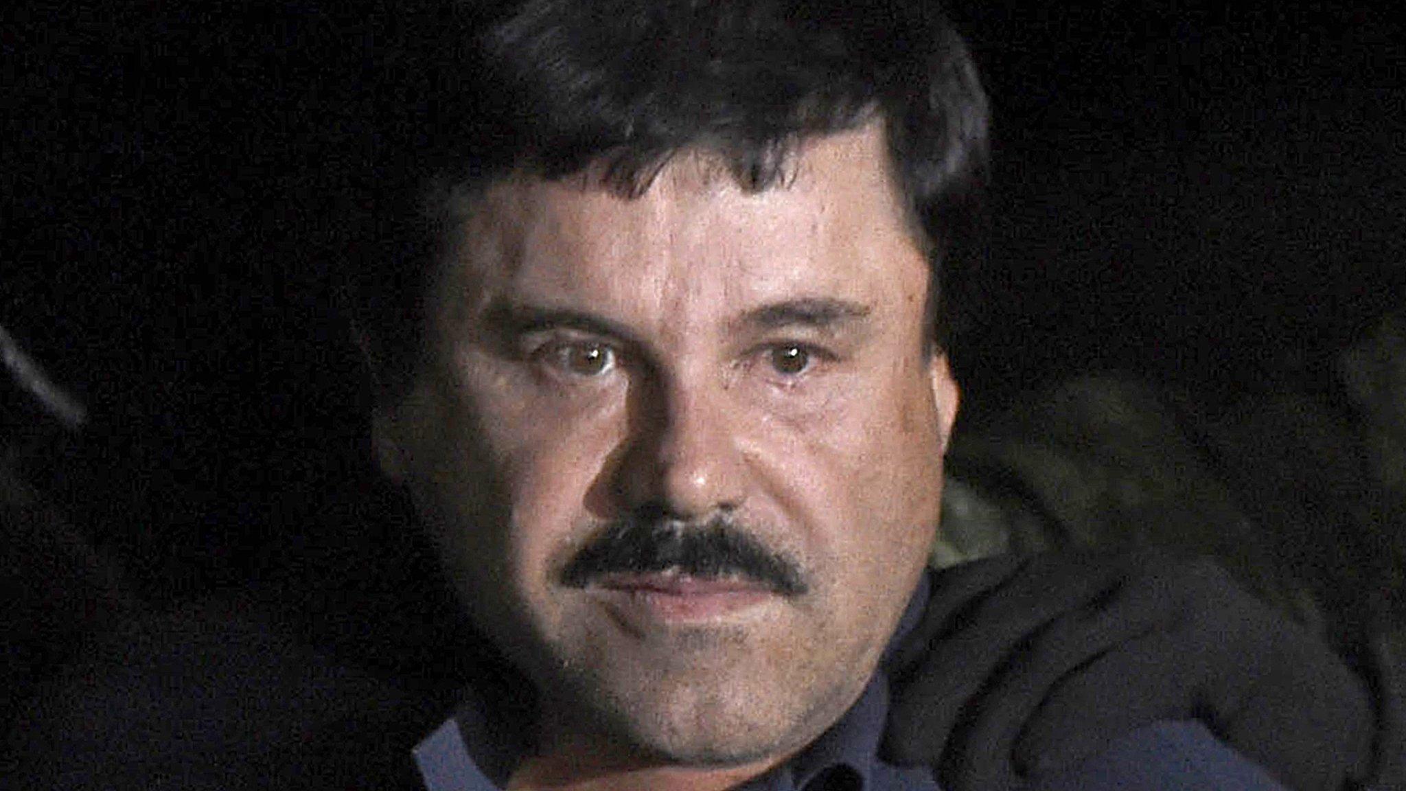 Joaquin "El Chapo" Guzman escorted into a helicopter at Mexico City's airport following his recapture in Los Mochis, in Sinaloa State. 8 Jan 2016